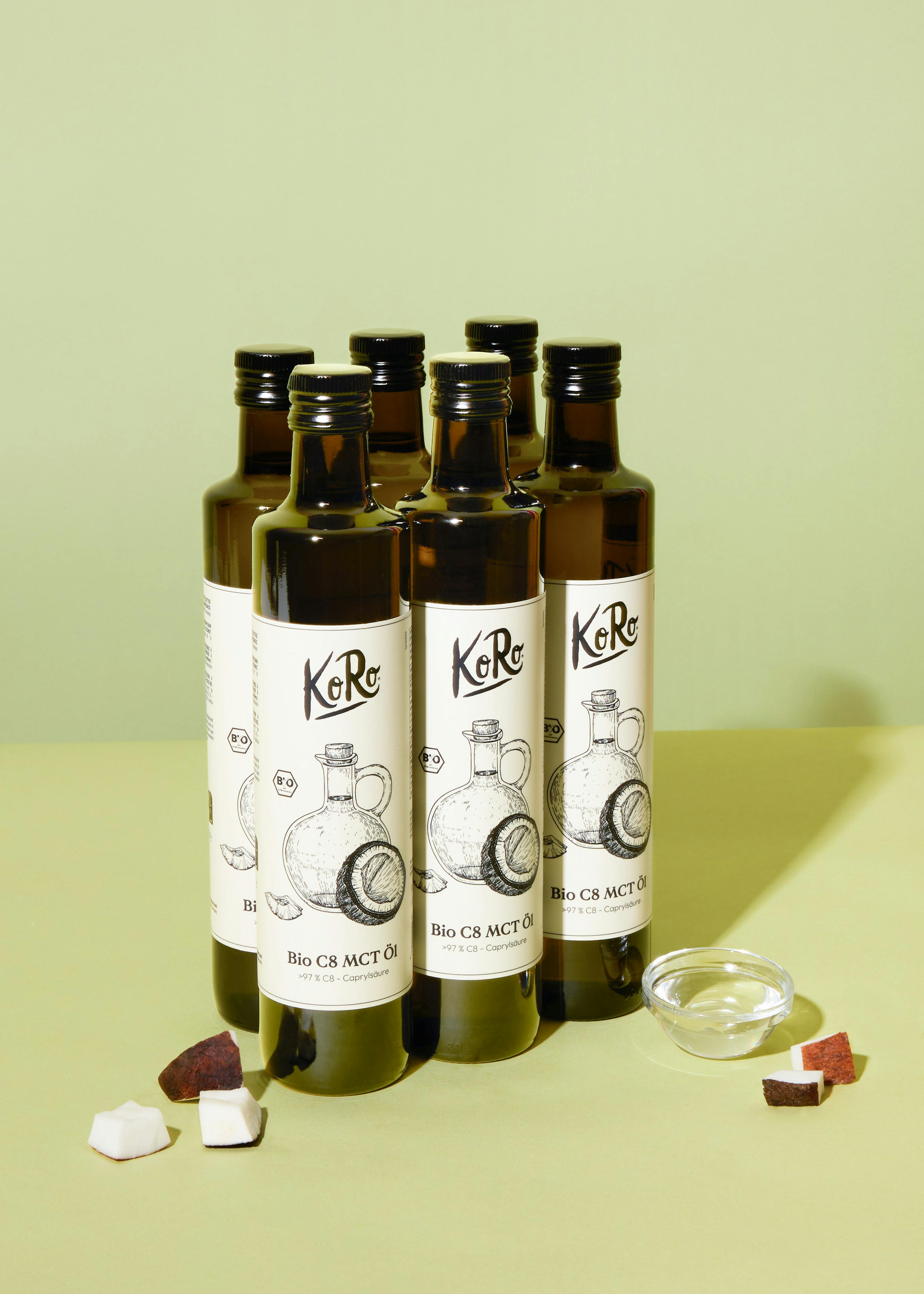 six bottles of kore bio c8 mct oil on a table