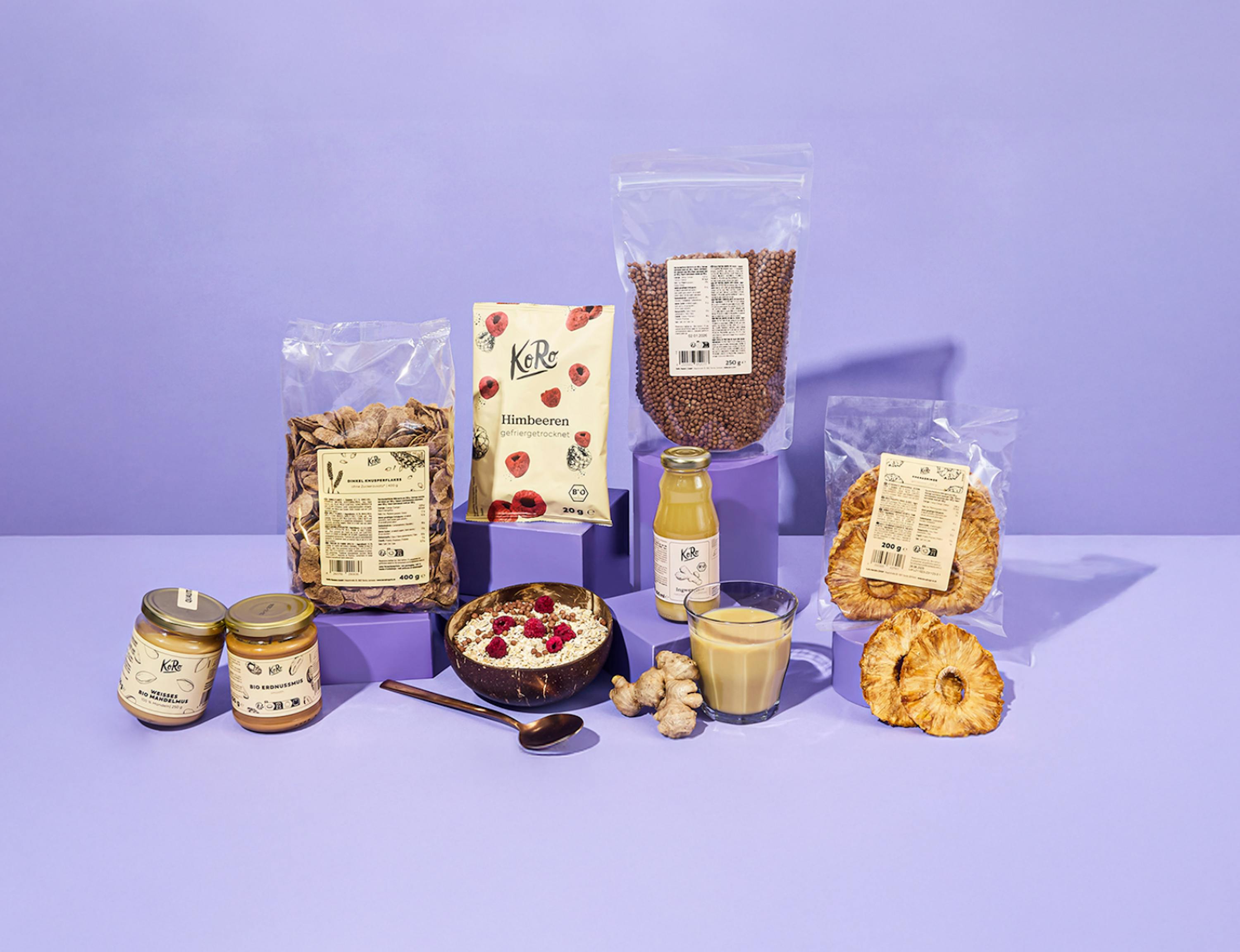 a variety of kellogg 's products are displayed on a purple table