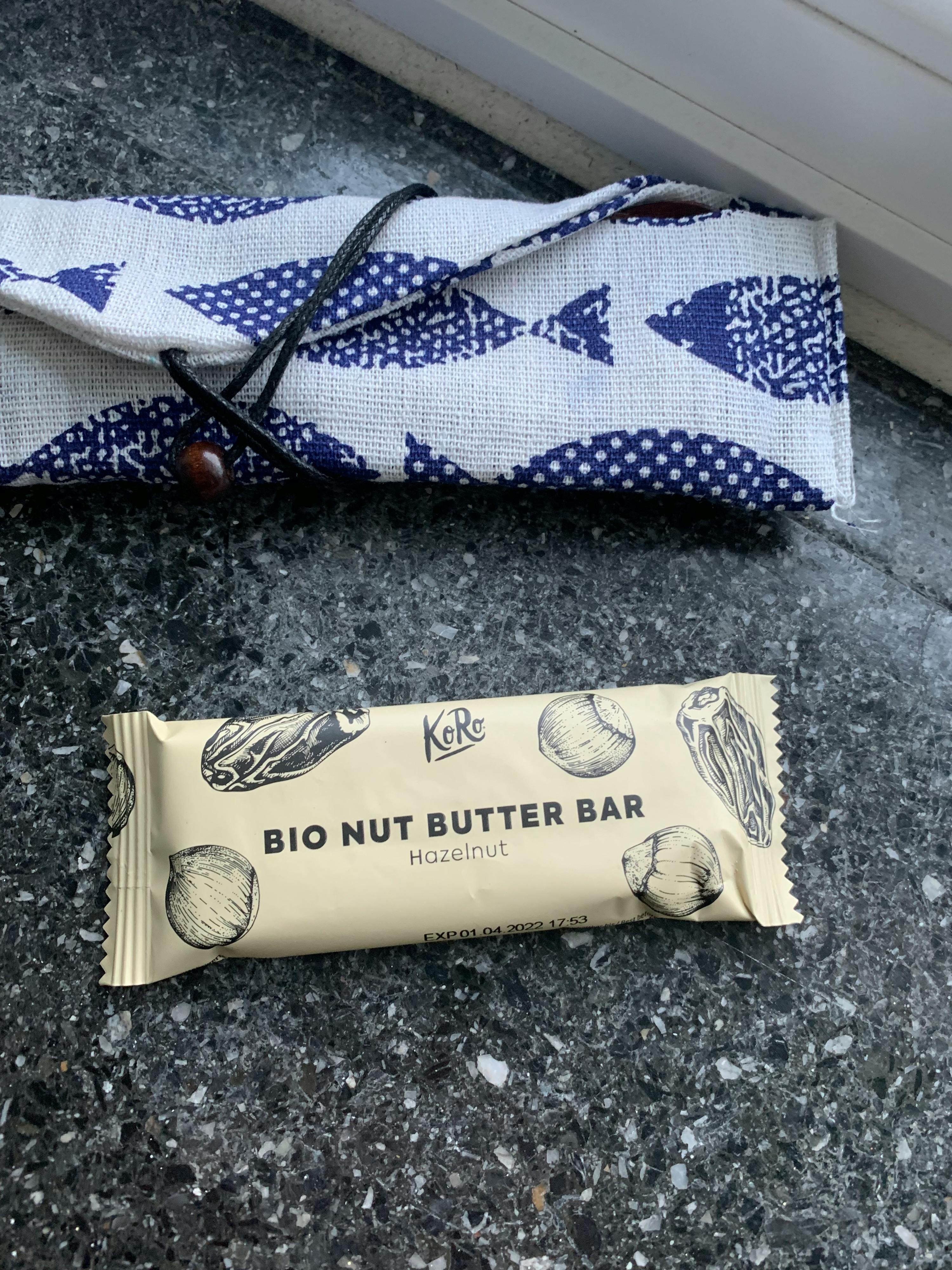 a package of bio nut butter bar hazelnut next to a napkin