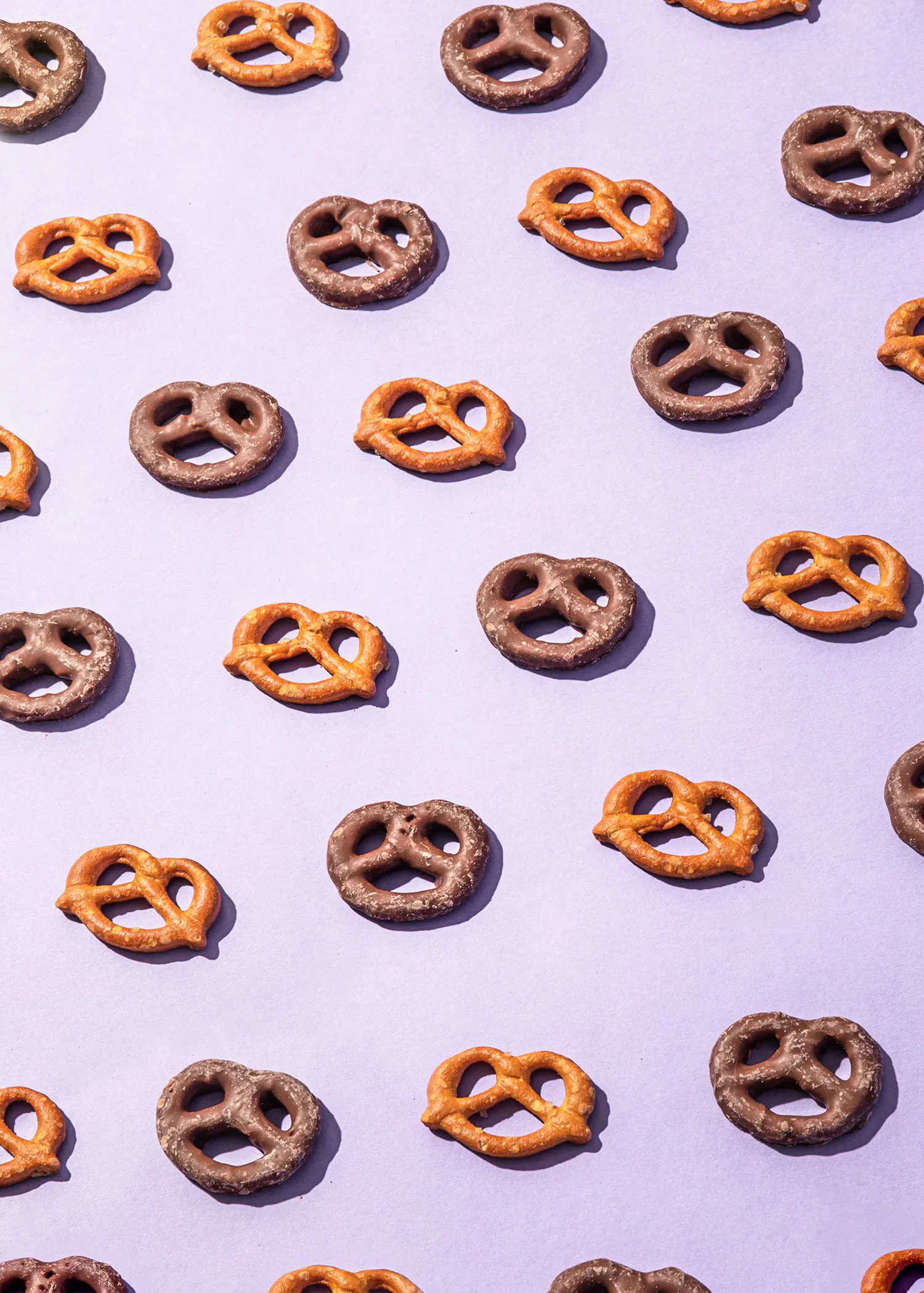 a pattern of pretzels on a purple surface
