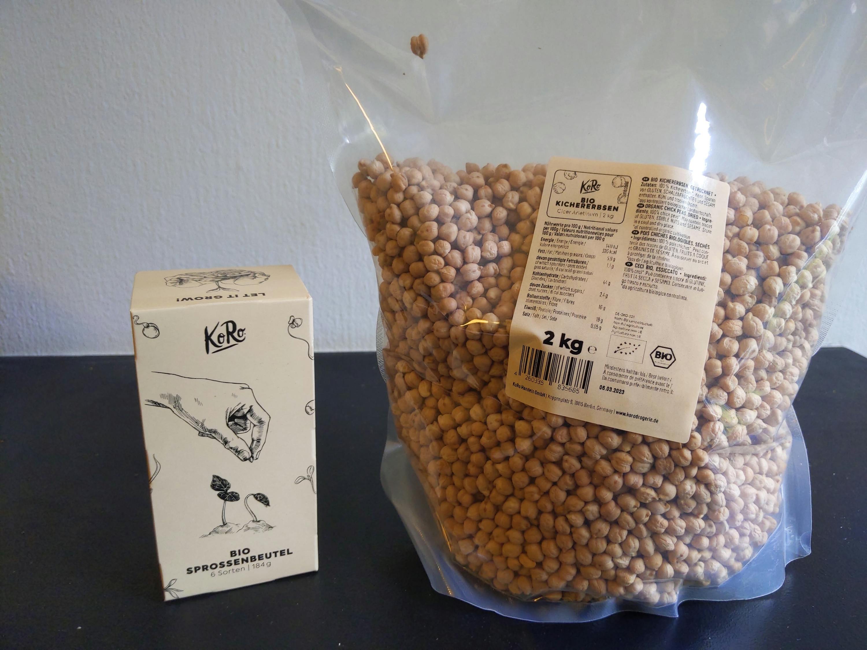 a bag of chickpeas sits next to a box that says " bio sprossenbeutel "