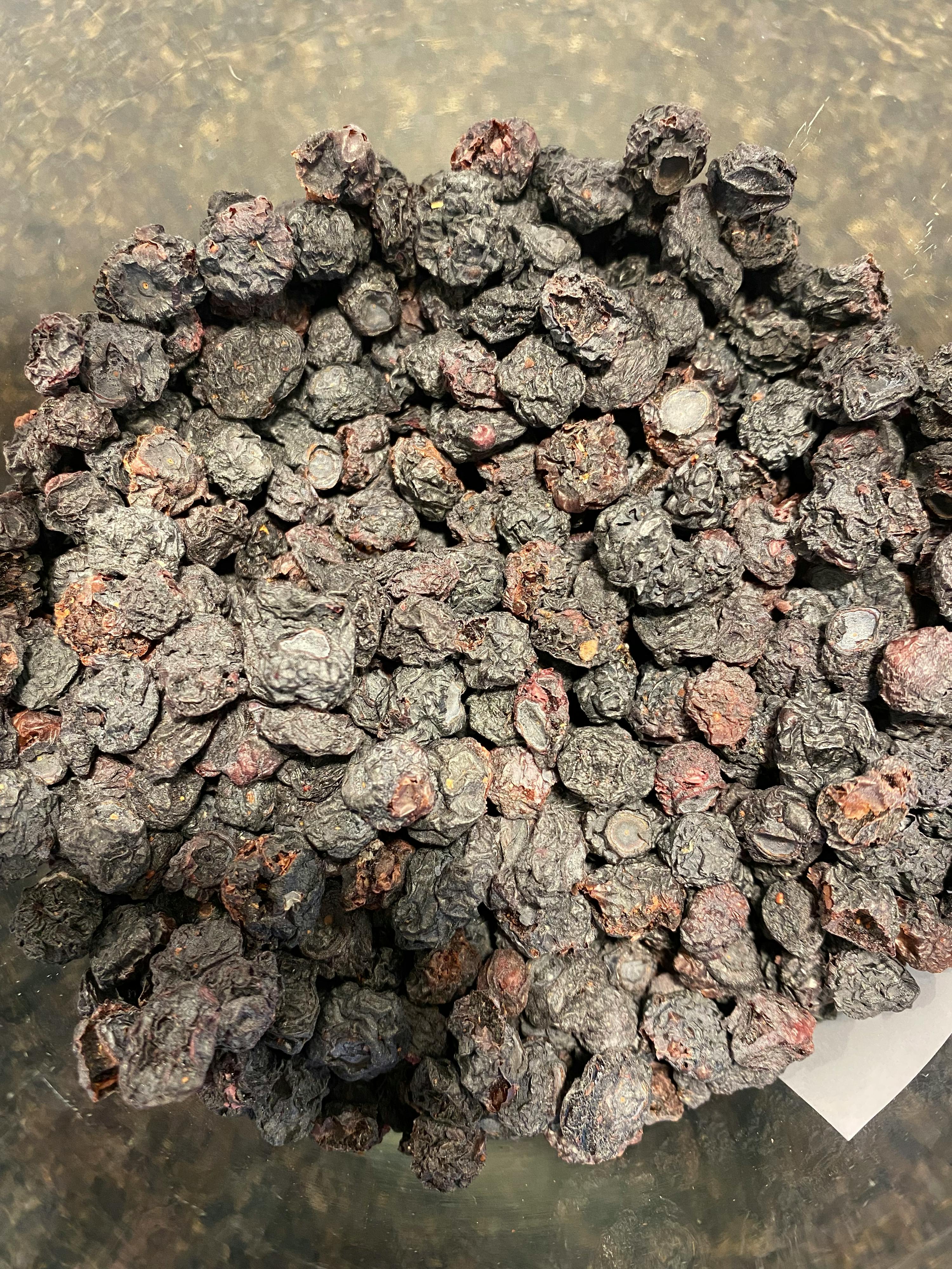 a pile of raisins in a clear container