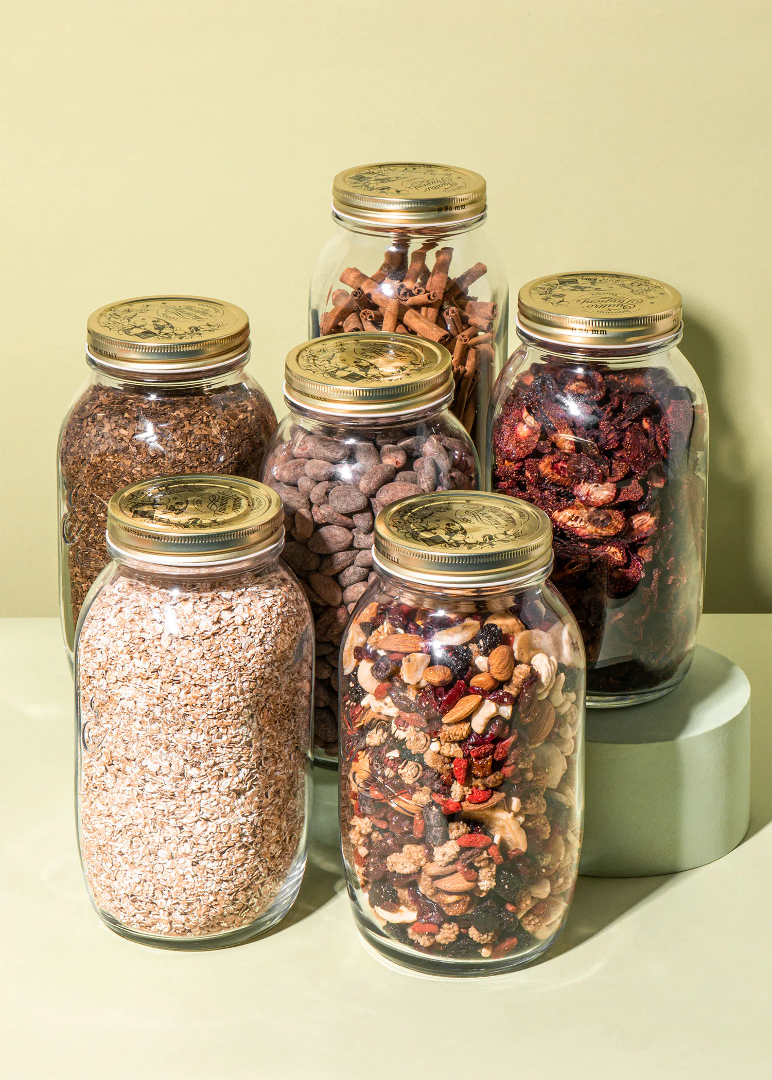 a group of jars filled with nuts and dried fruits