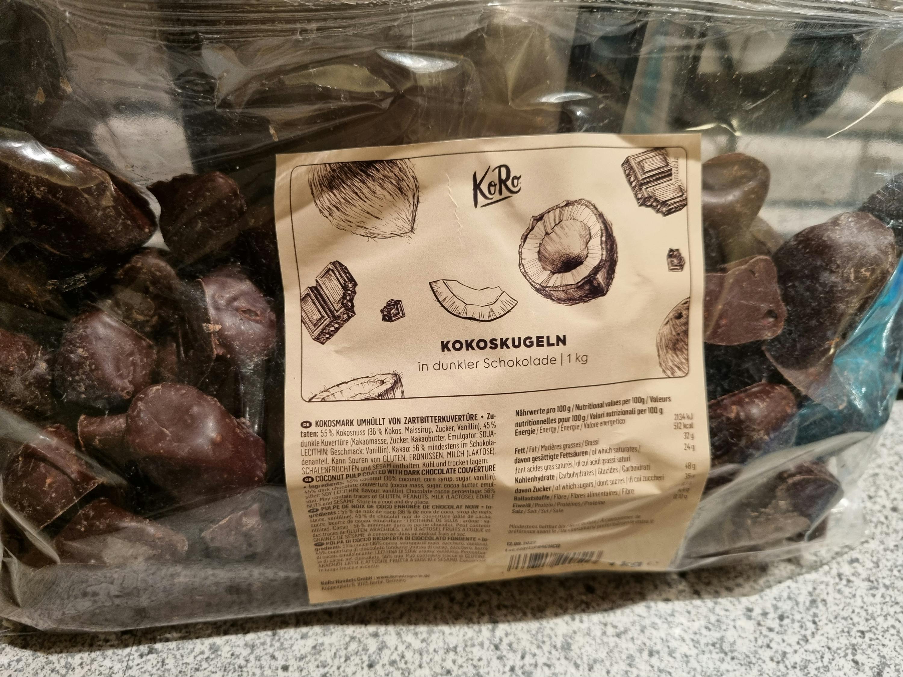 a bag of chocolate covered coconuts with a label that says kokoskugeln