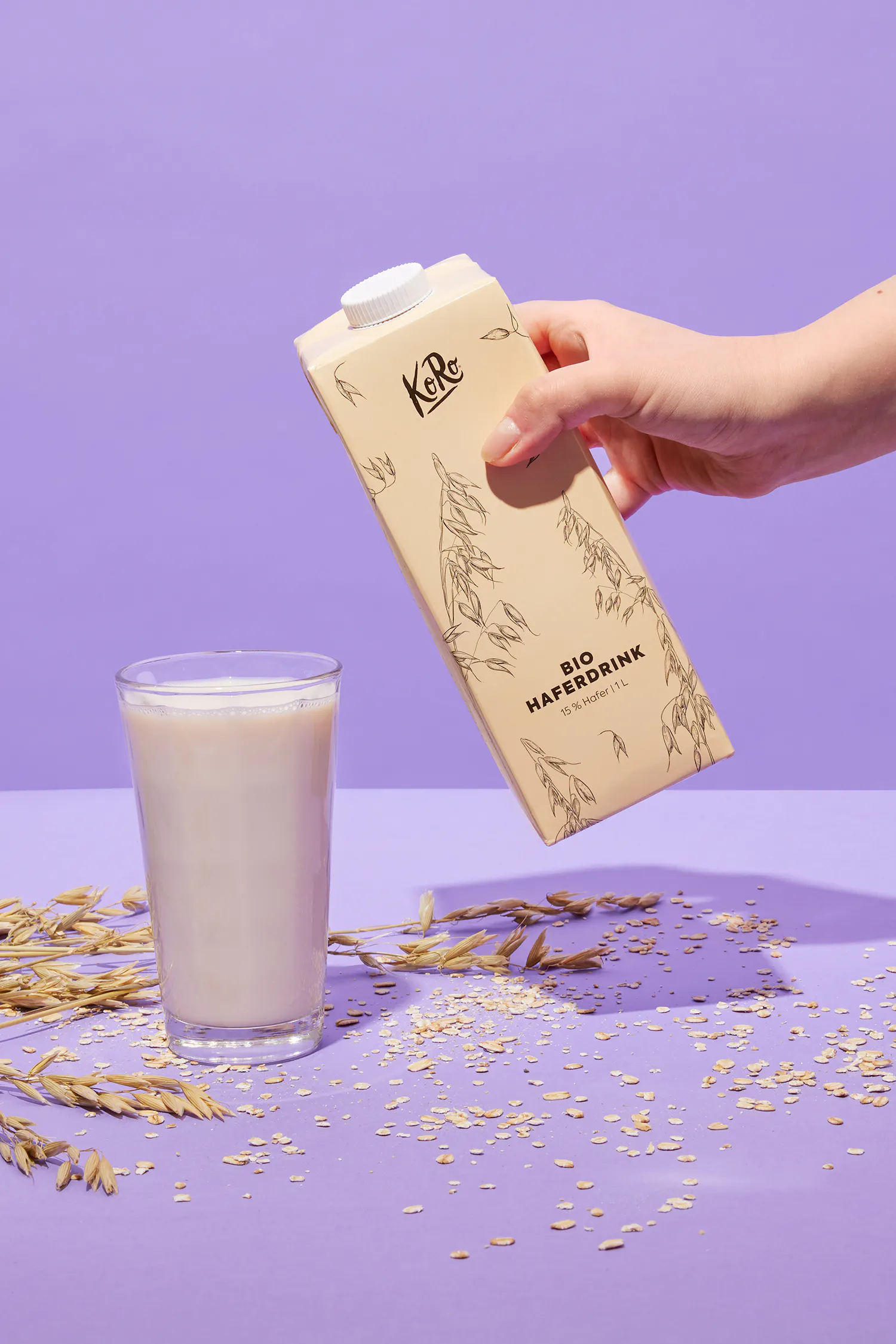 a bottle of bio haferdrink is being poured into a glass