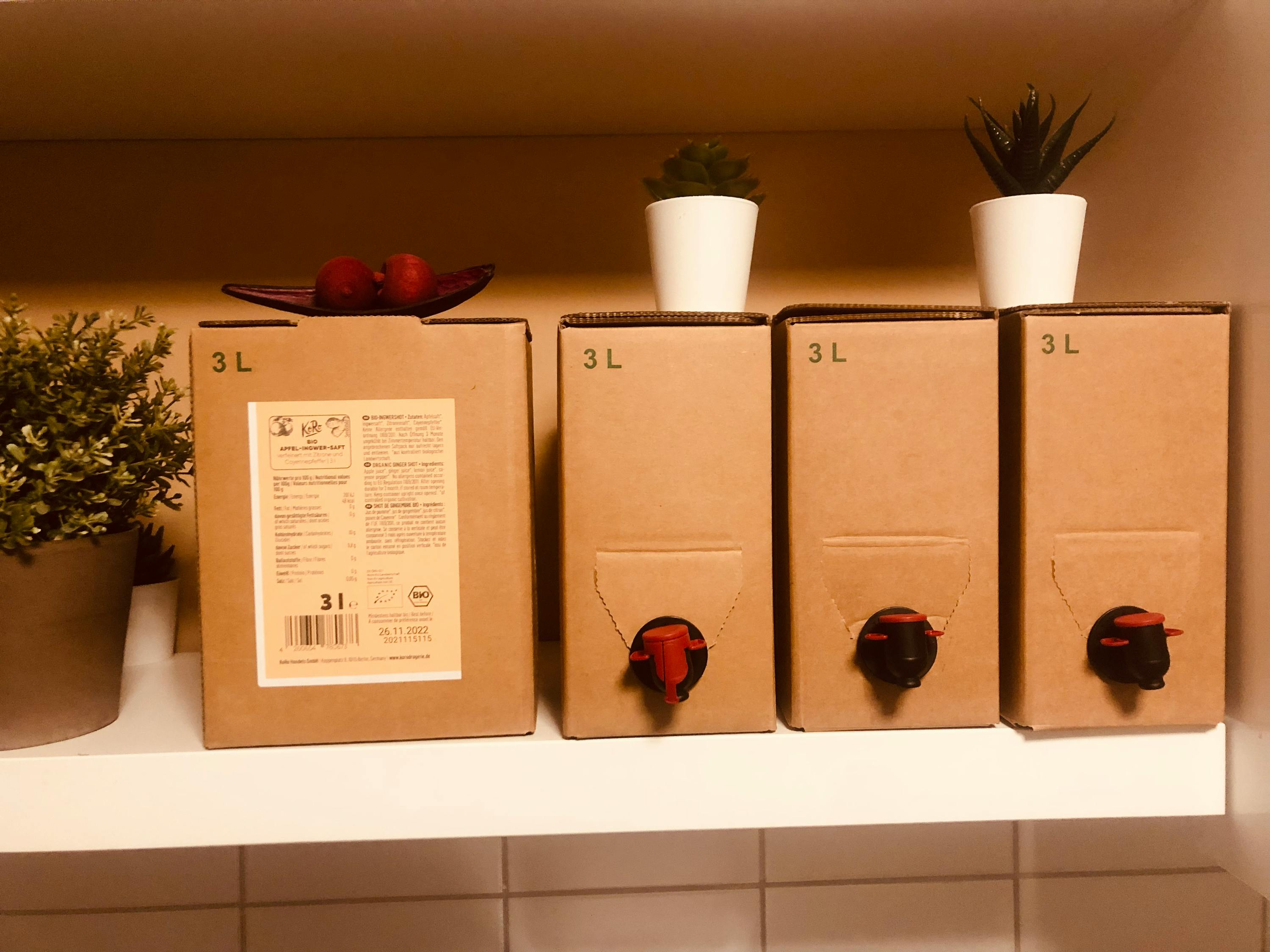 three cardboard boxes on a shelf with the numbers 3l on them