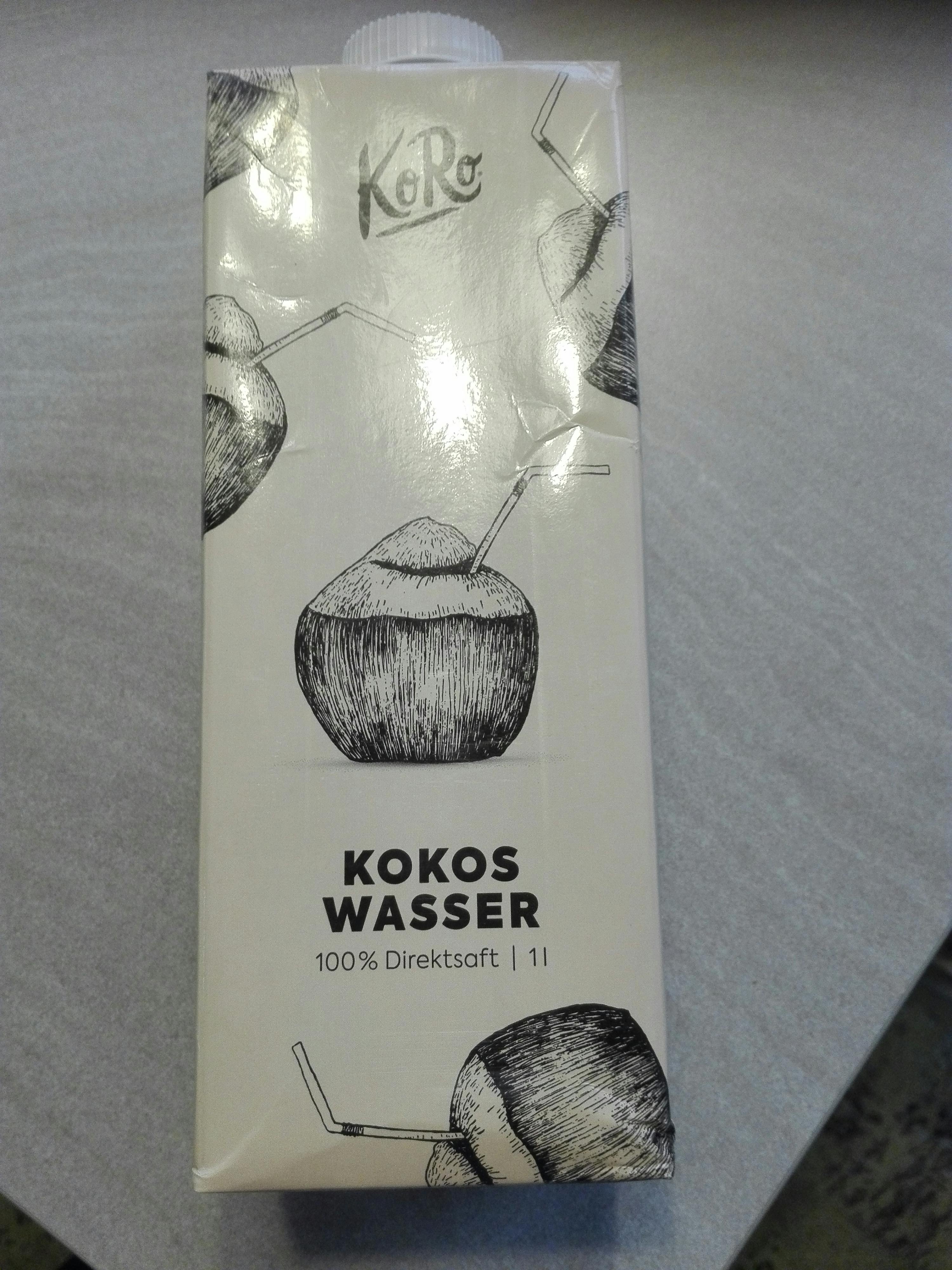 a carton of kokos wasser 100 % direktsaft sits on a table