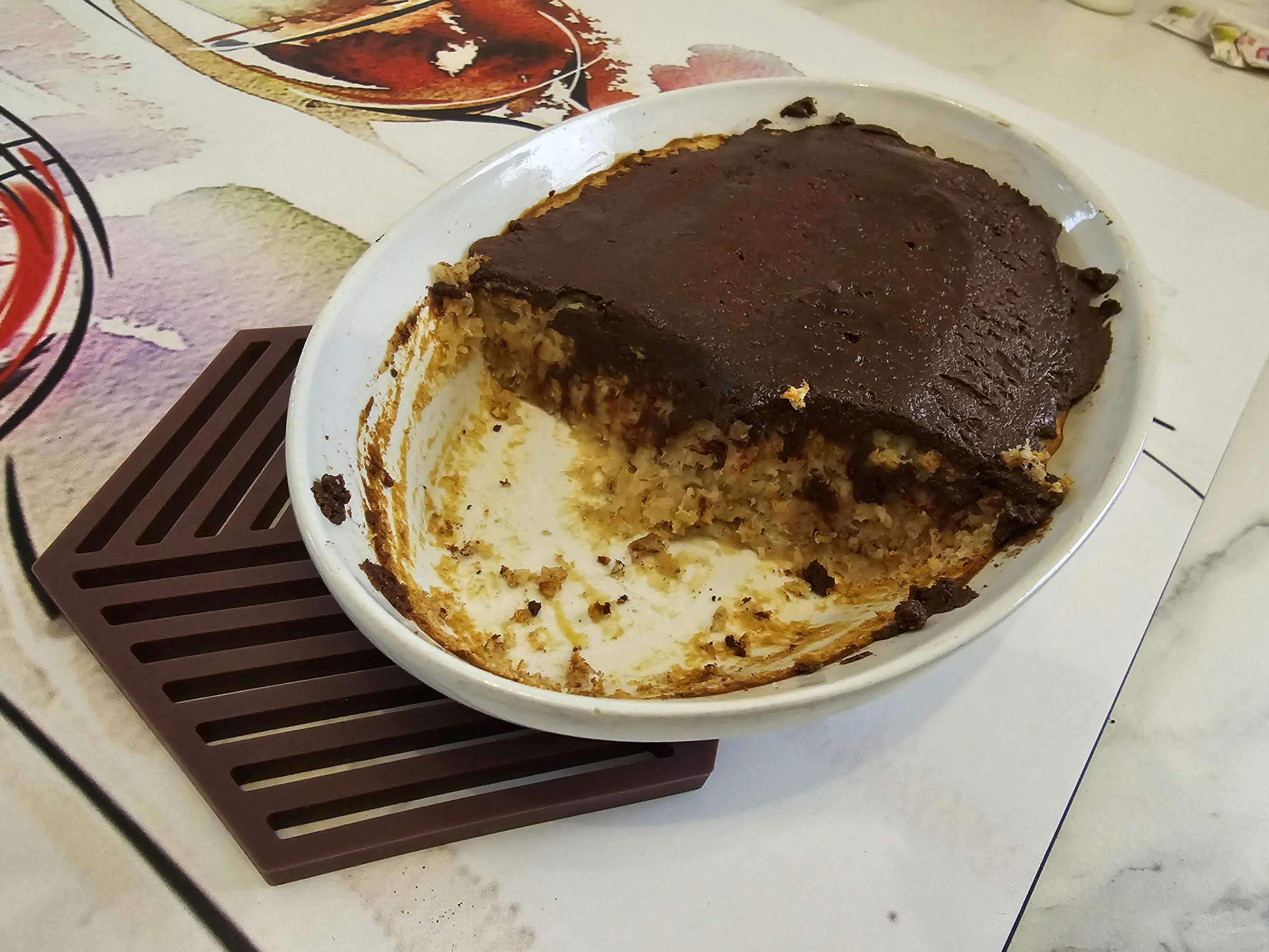 a casserole dish with a slice taken out of it