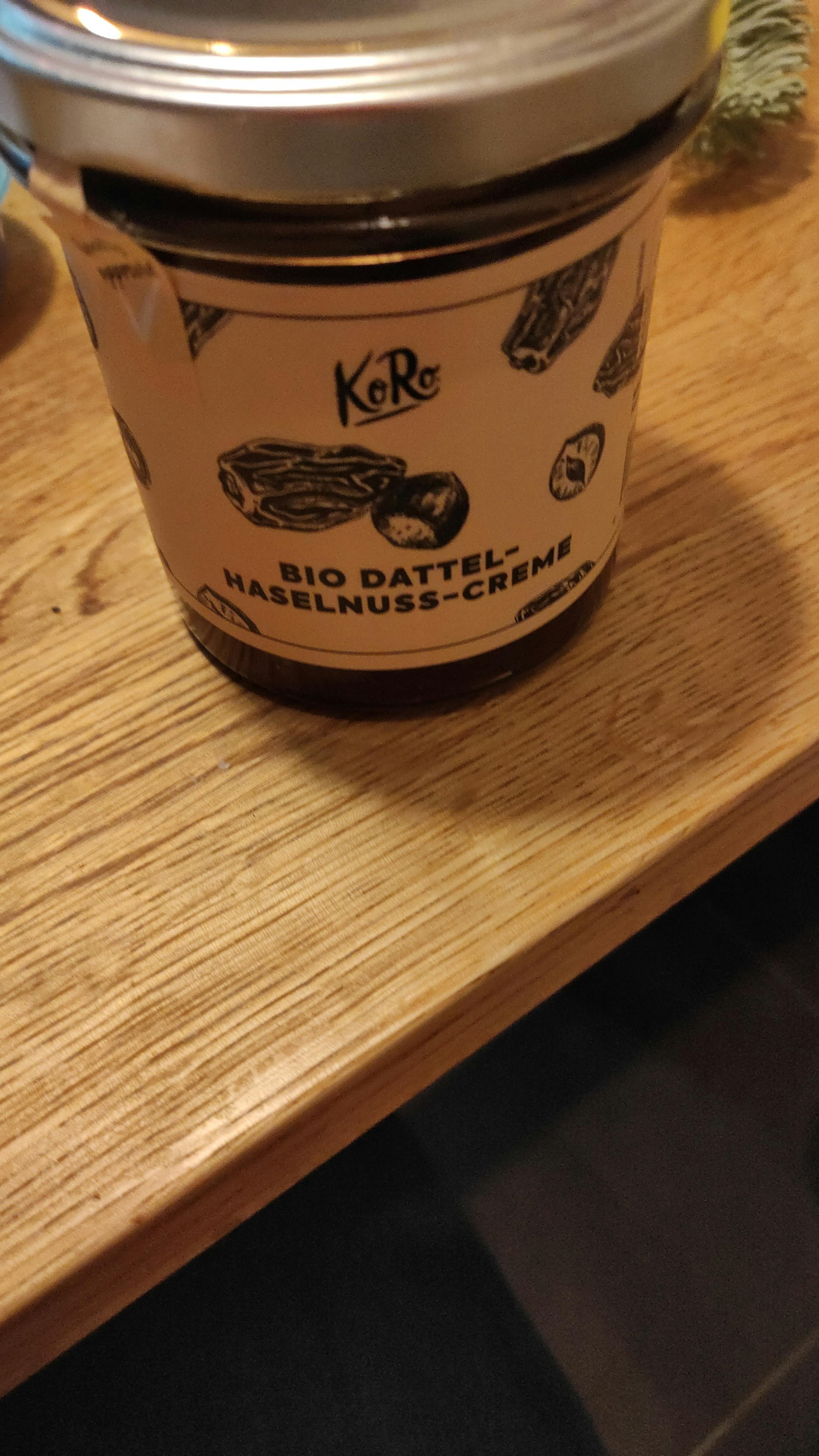 a jar of bio datteln hazelnus-creme on a wooden table