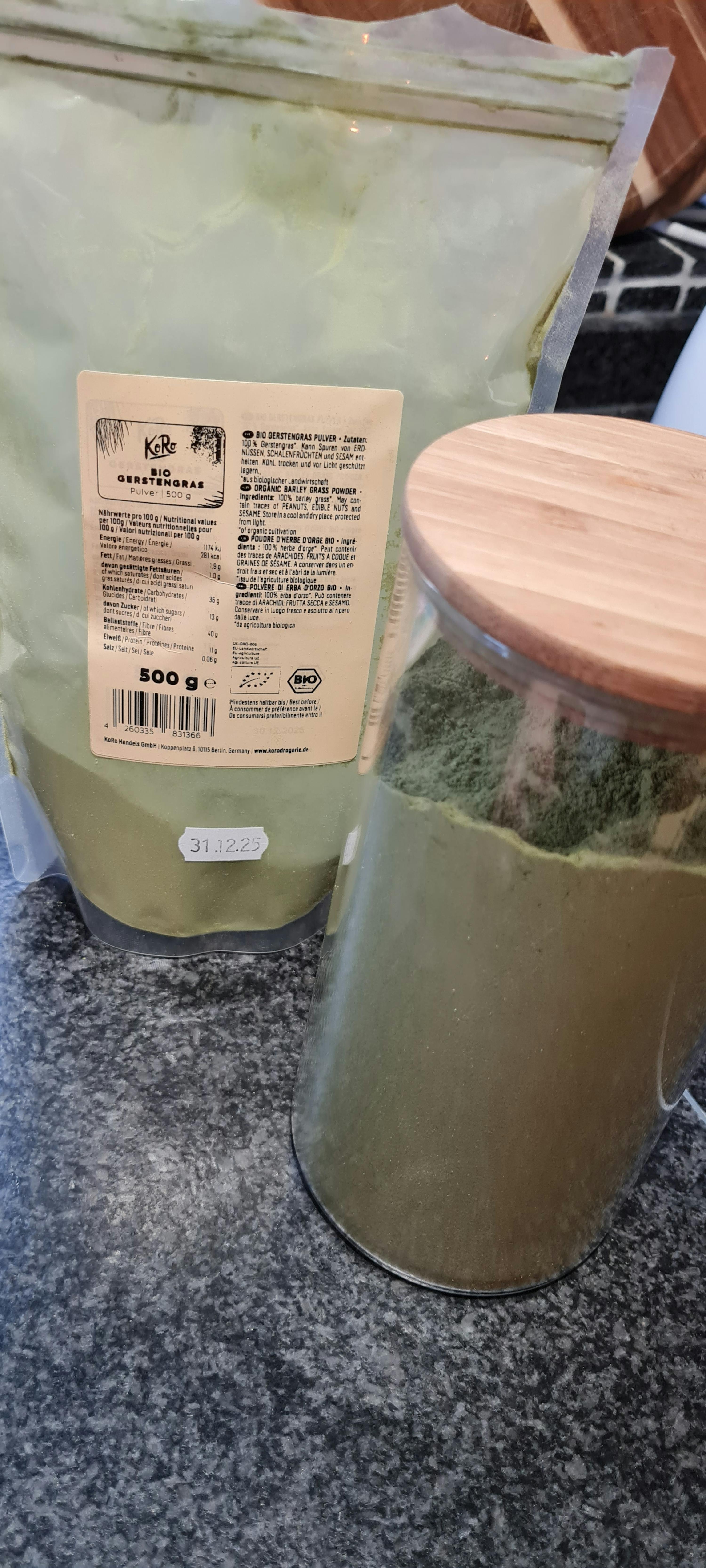 a container of green powder has a label that says kb on it