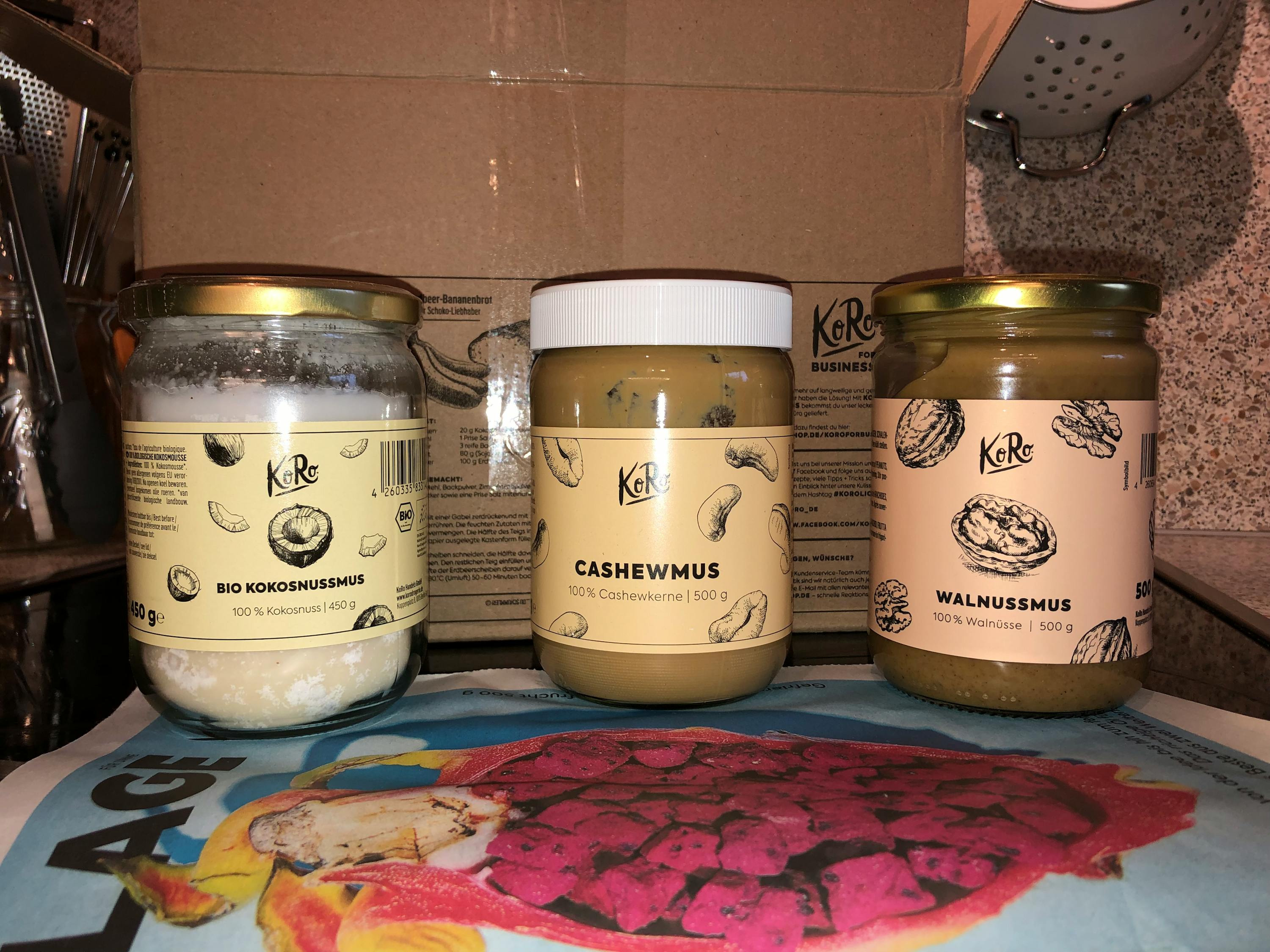 a jar of cashewmus sits next to two jars of walnussmus