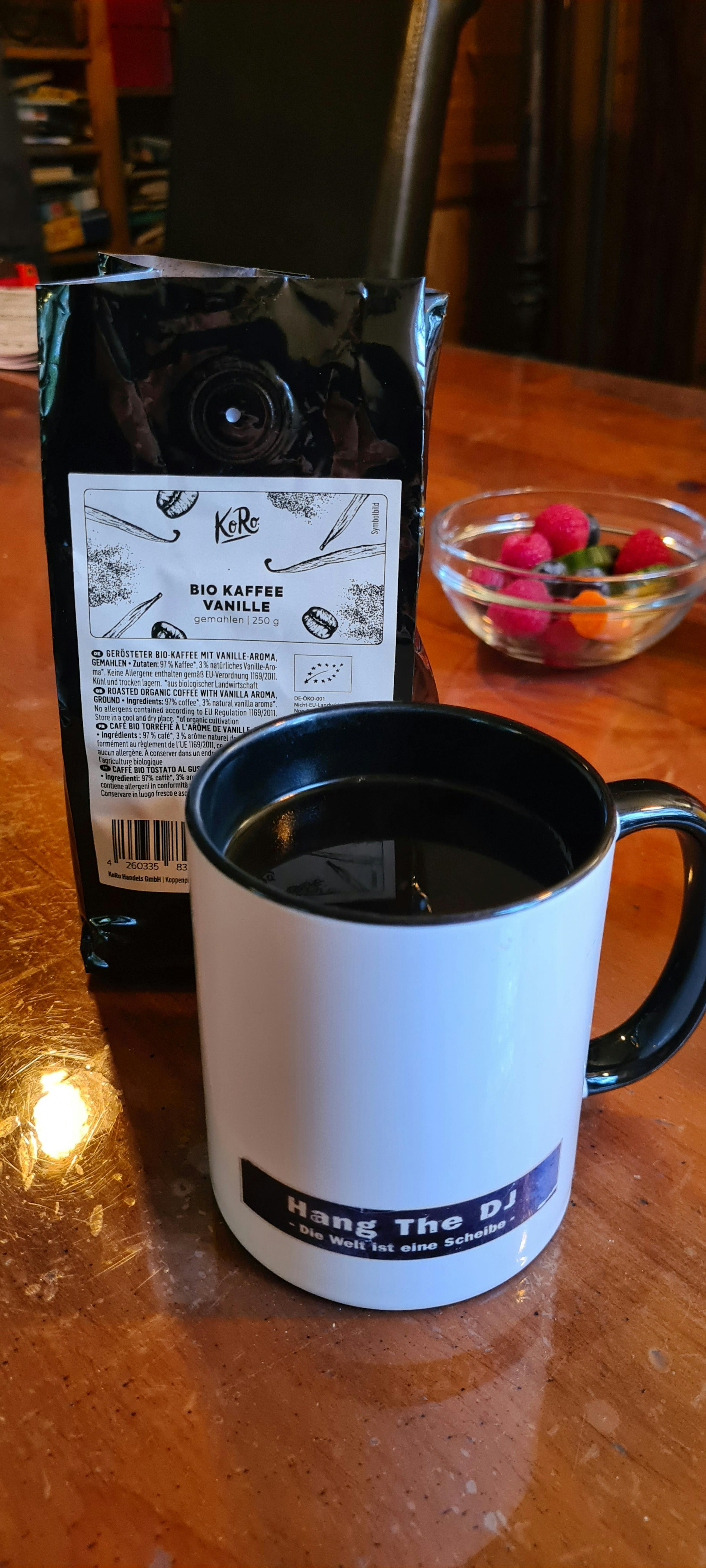 a bag of signature vanilla next to a mug that says hang the dj