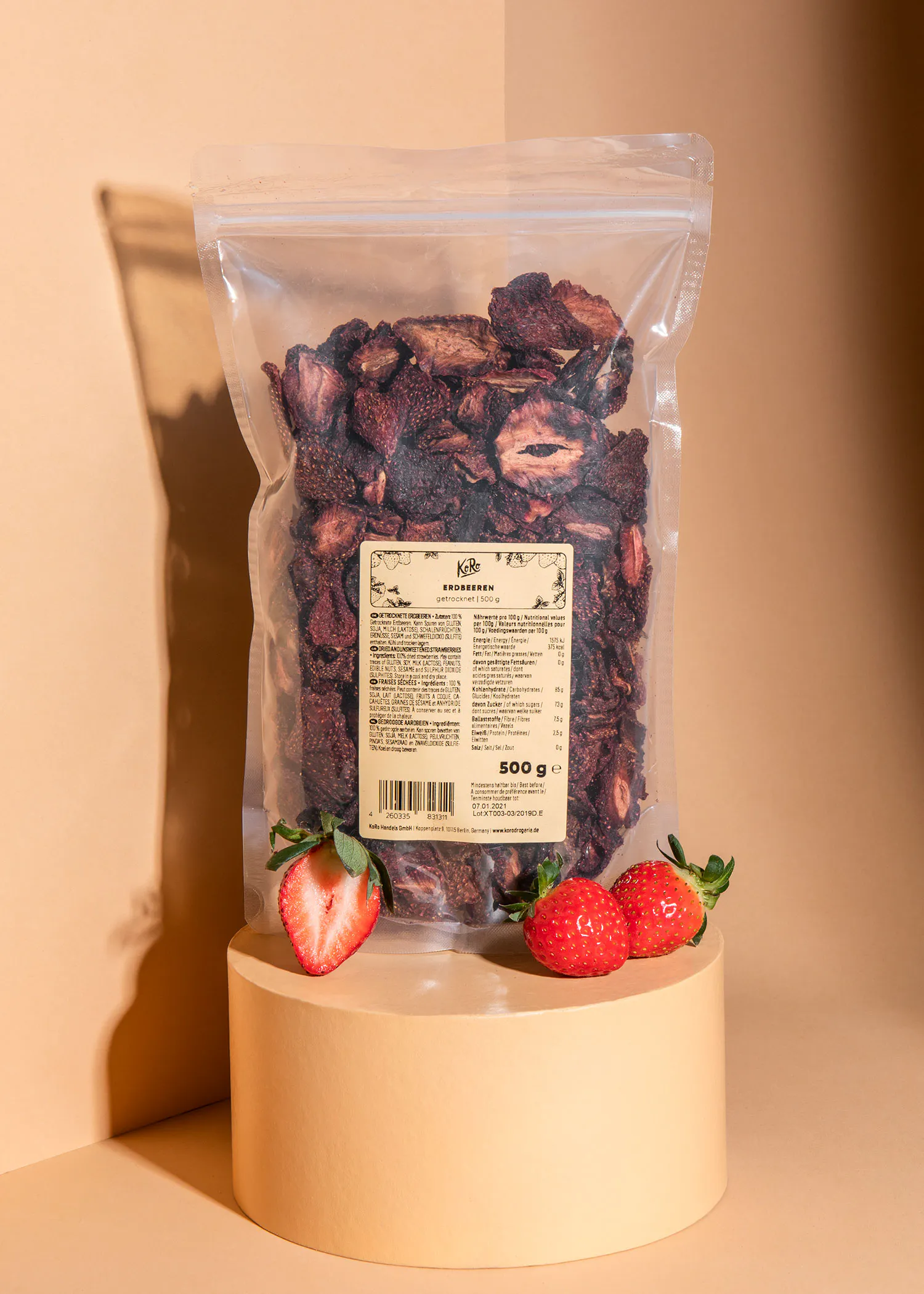 a bag of dried strawberries sits on a podium