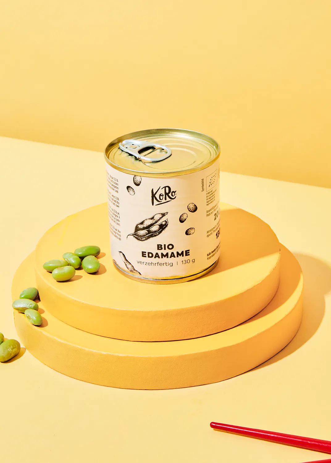 a can of bio edamame on a yellow circle