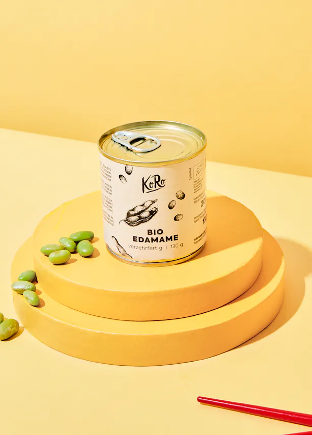 a can of bio edamame on a yellow circle
