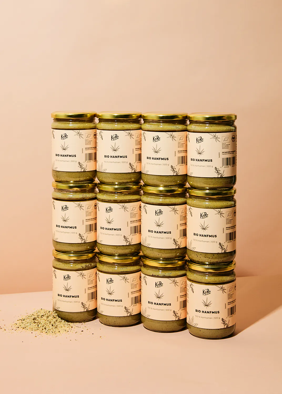 several jars of bio hanfmus are stacked on top of each other on a table