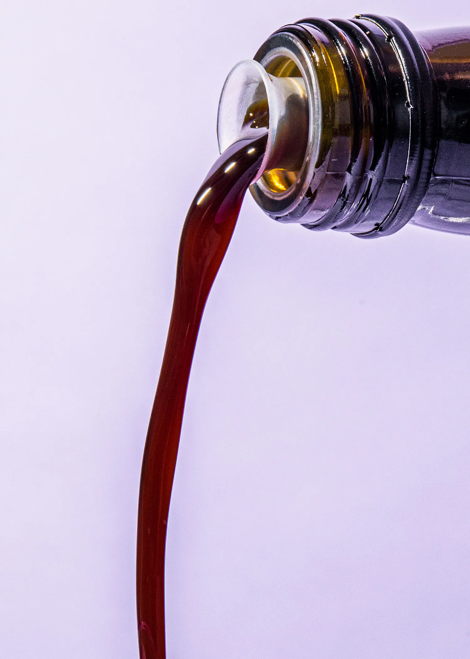 a brown liquid is pouring out of a bottle