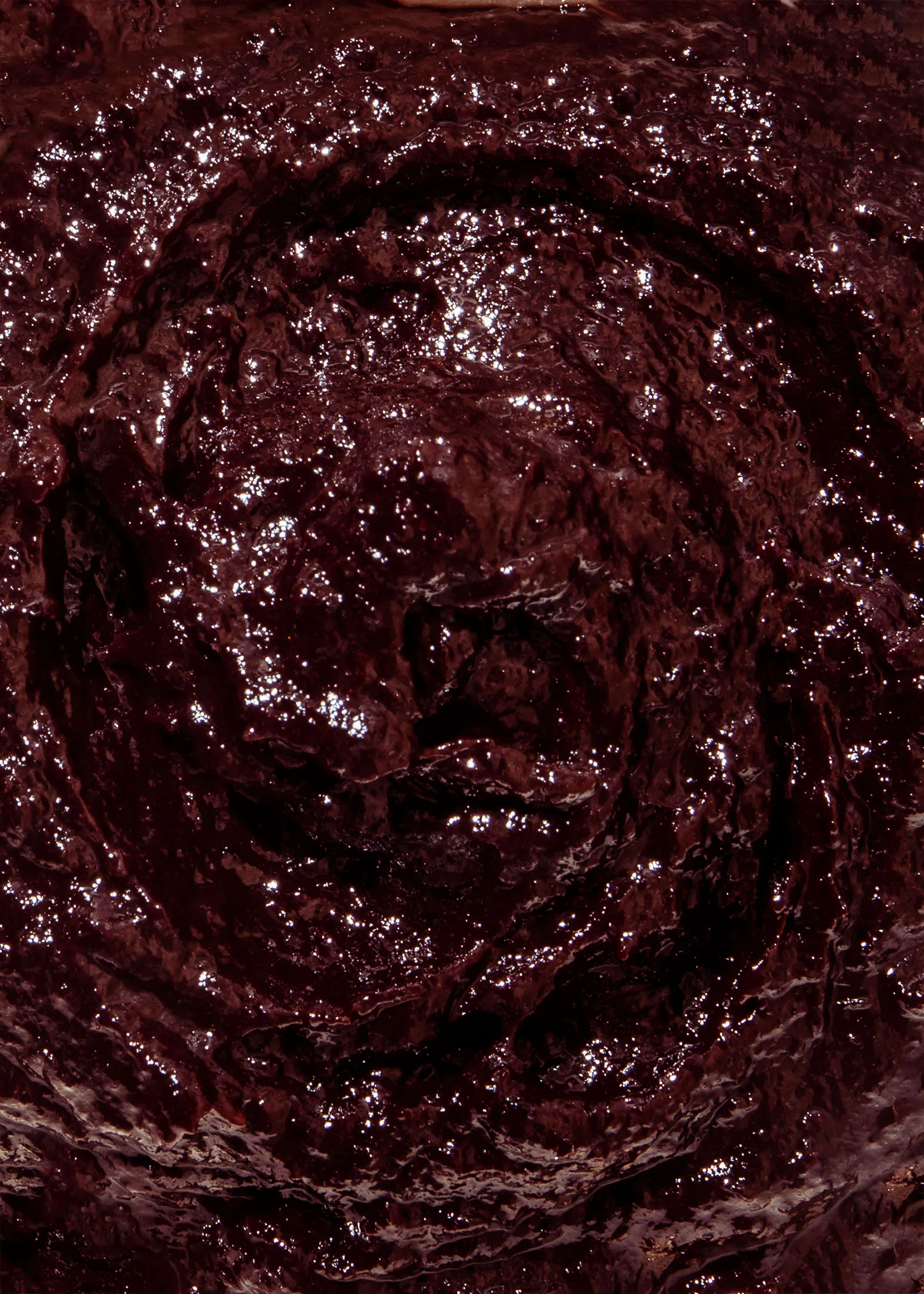 a close up of a swirl of dark chocolate