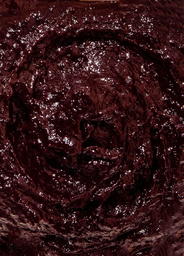 a close up of a swirl of dark chocolate