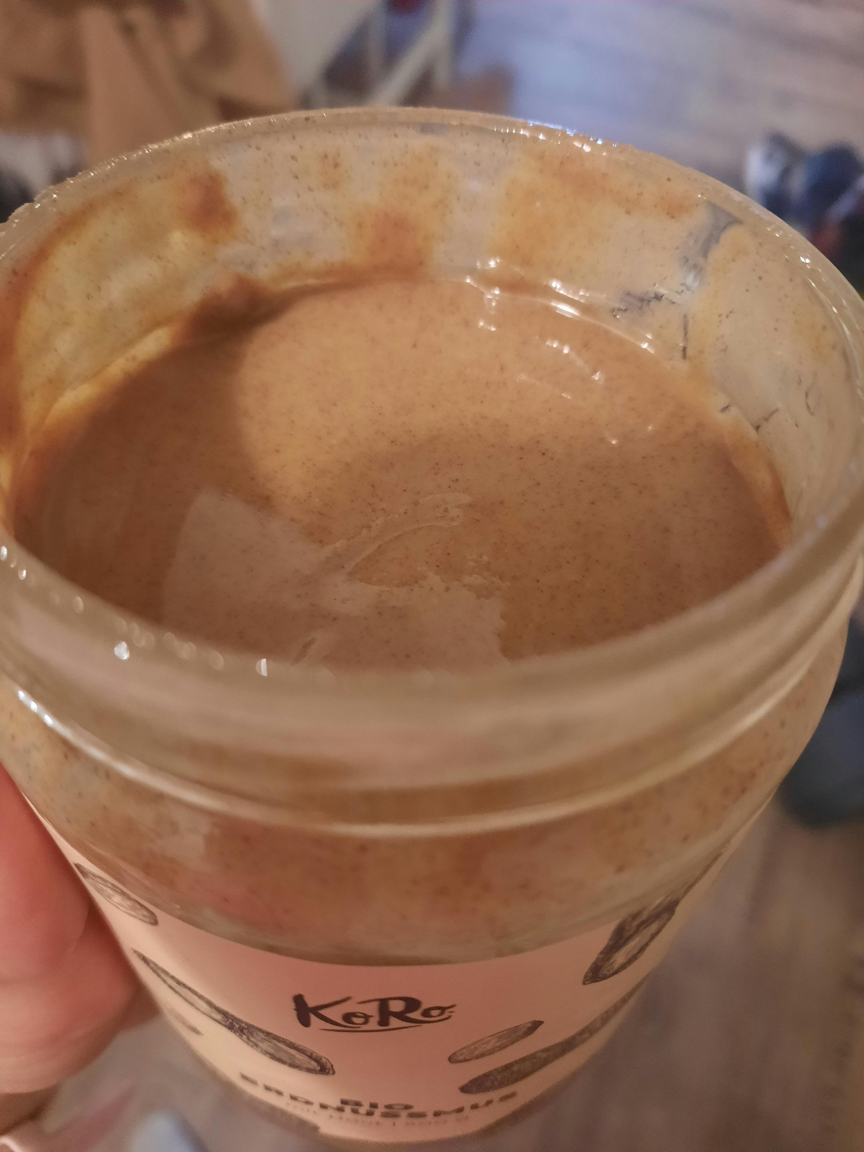 a jar of peanut butter has a label that says karo on it