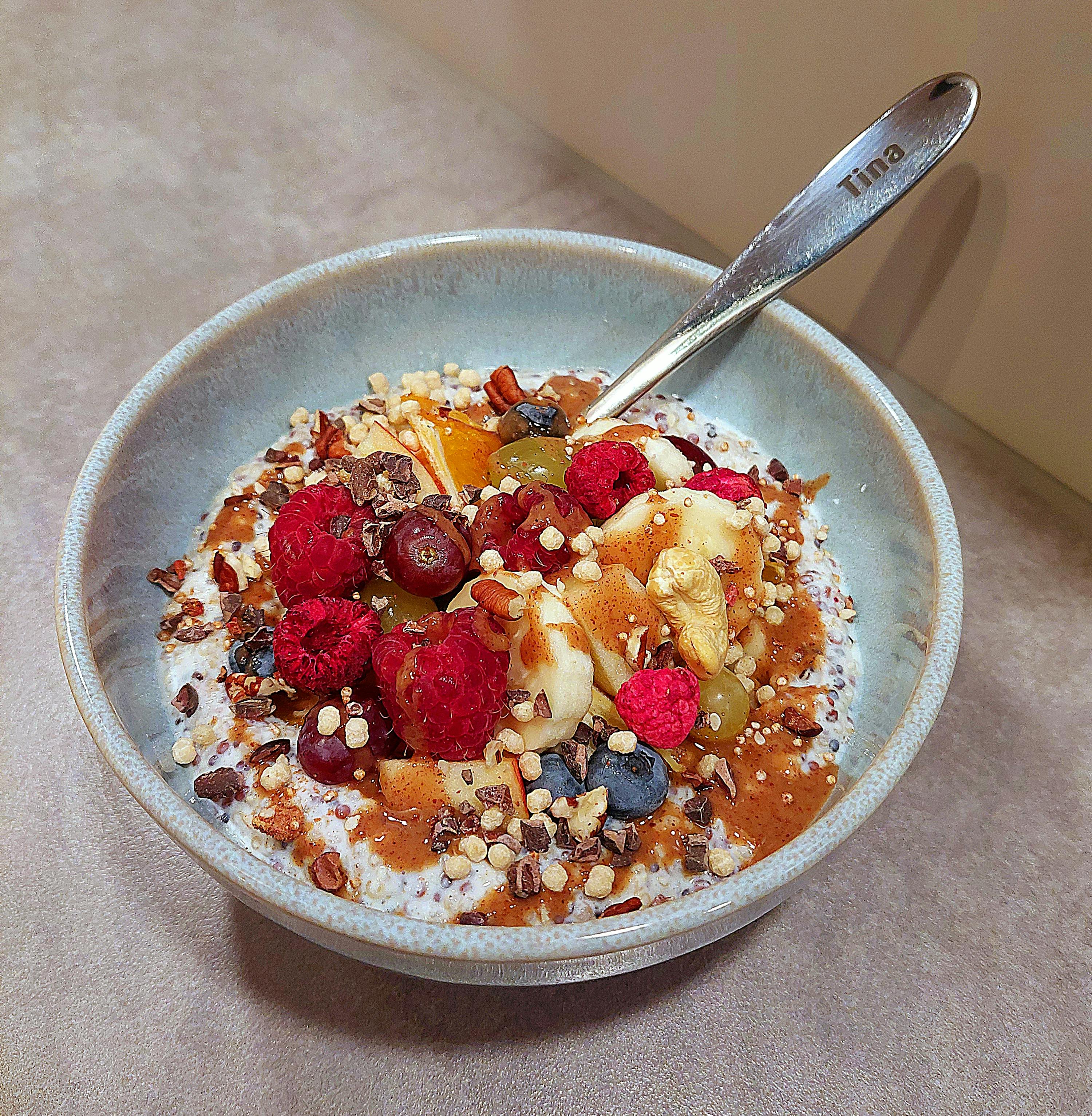 a bowl of food with a spoon that says tina