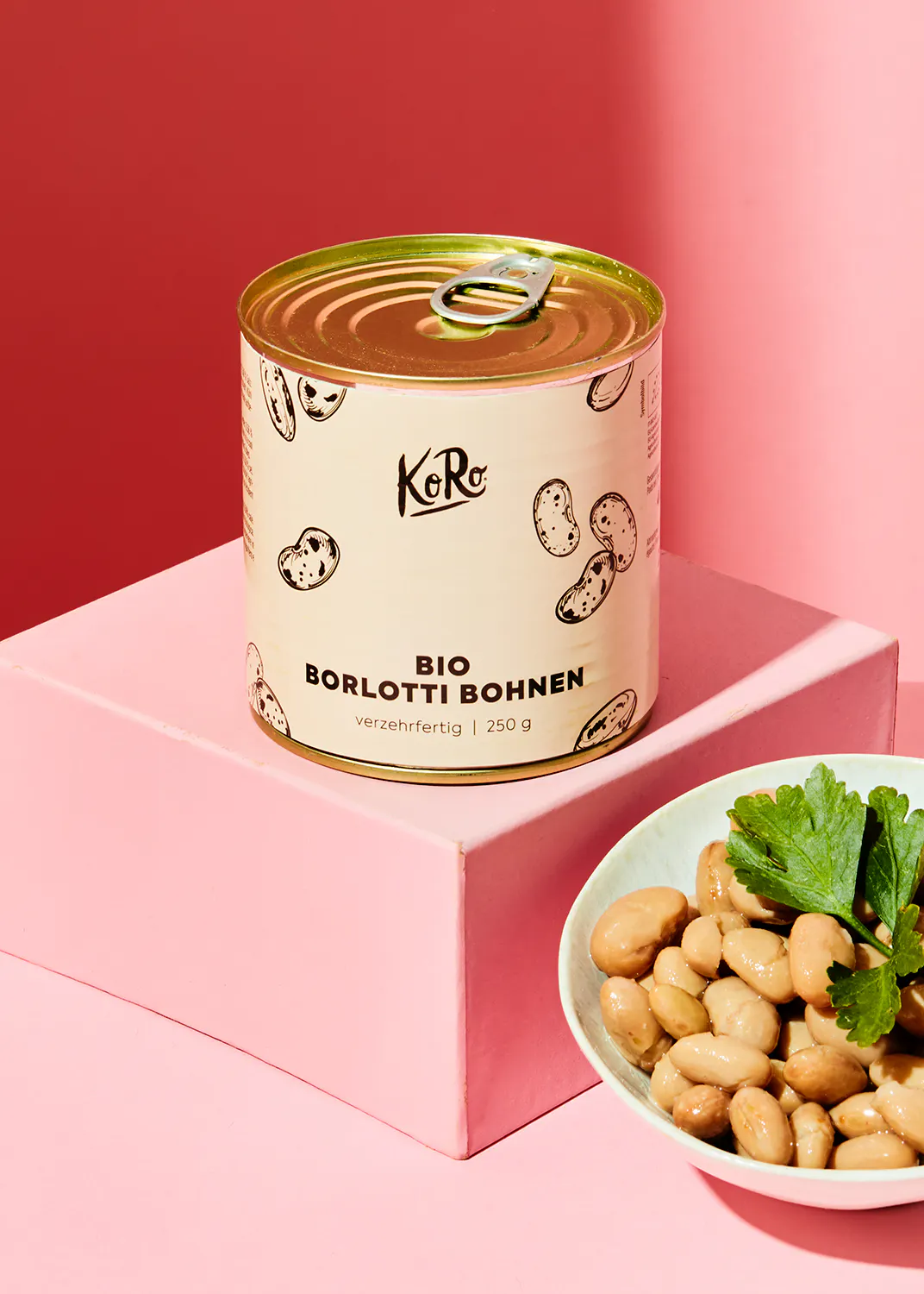 a can of bio borlotti bohnen is on a pink box