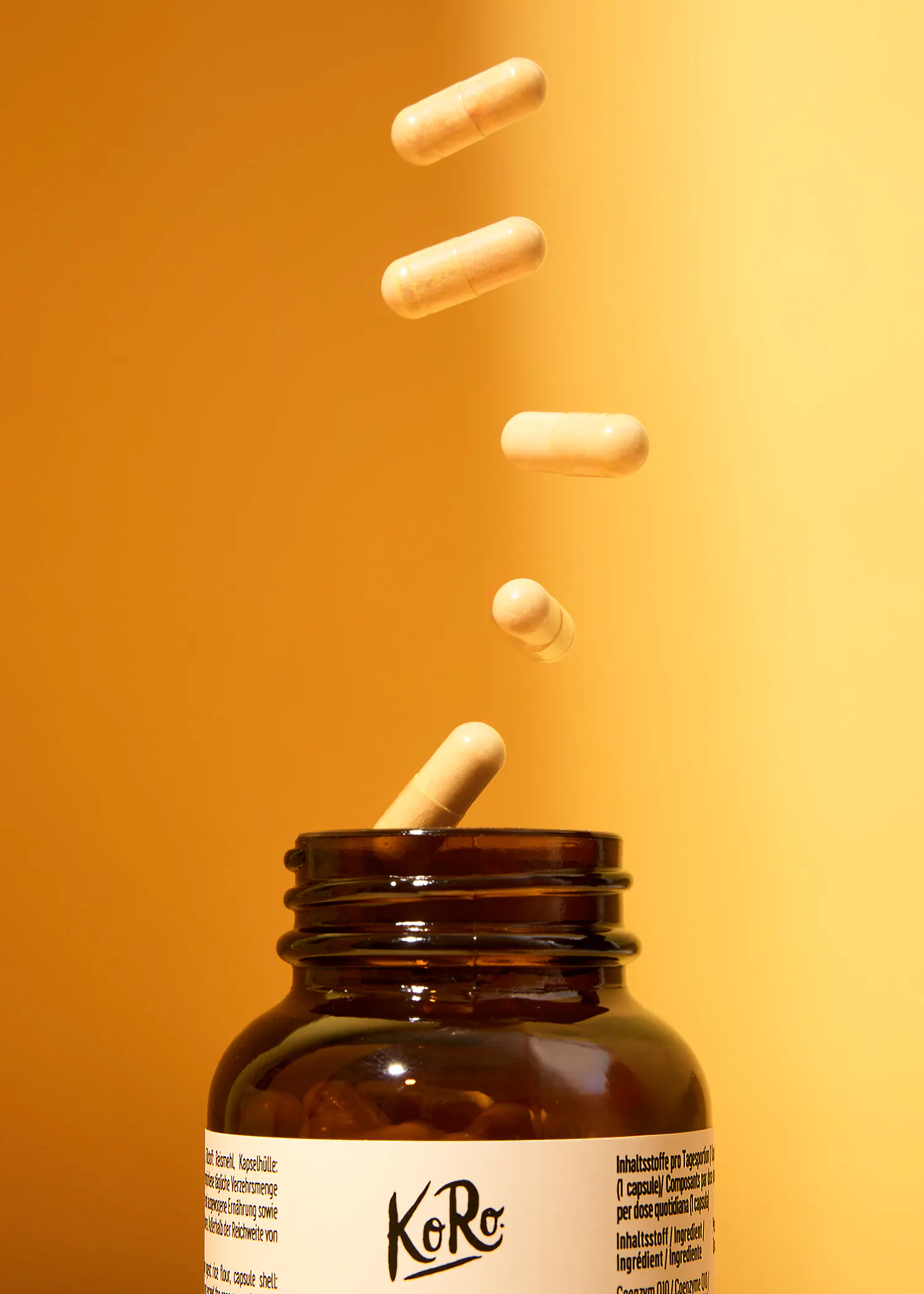 capsules falling out of a bottle that says koro