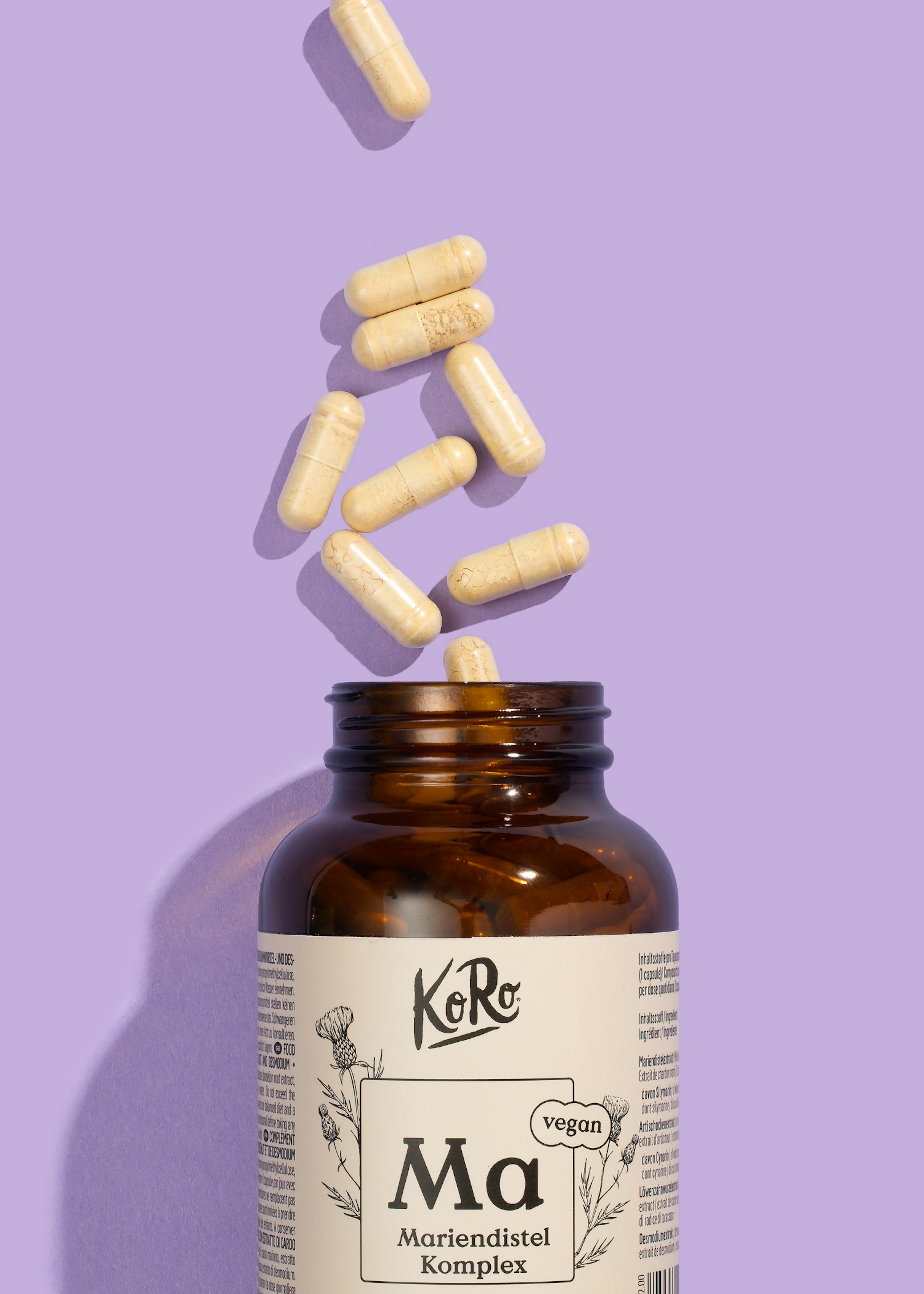 eine braune Flasche mit einem weißen Etikett und der Aufschrift ma mariendistel komplex