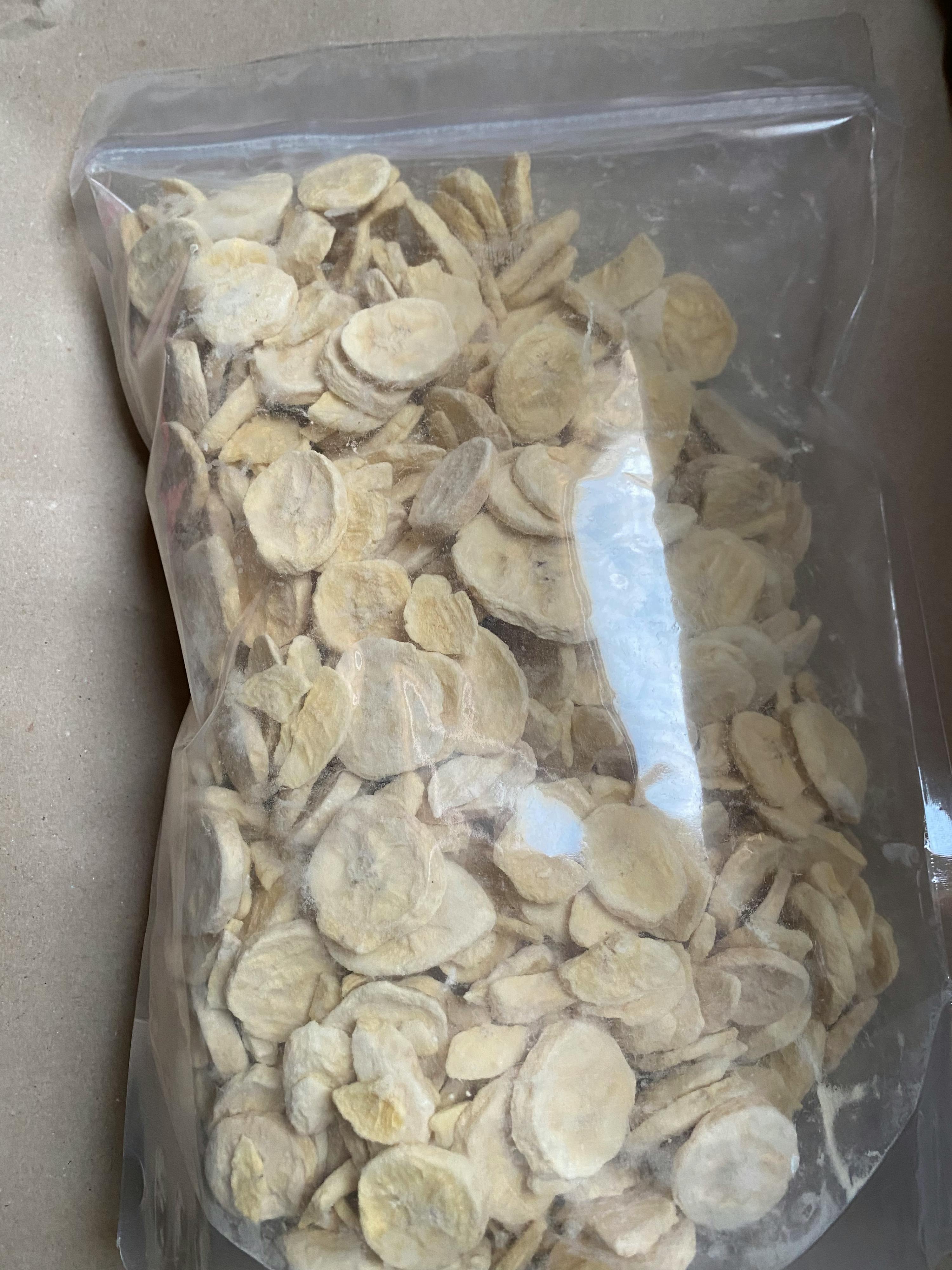 a bag of dried banana slices sits on a table