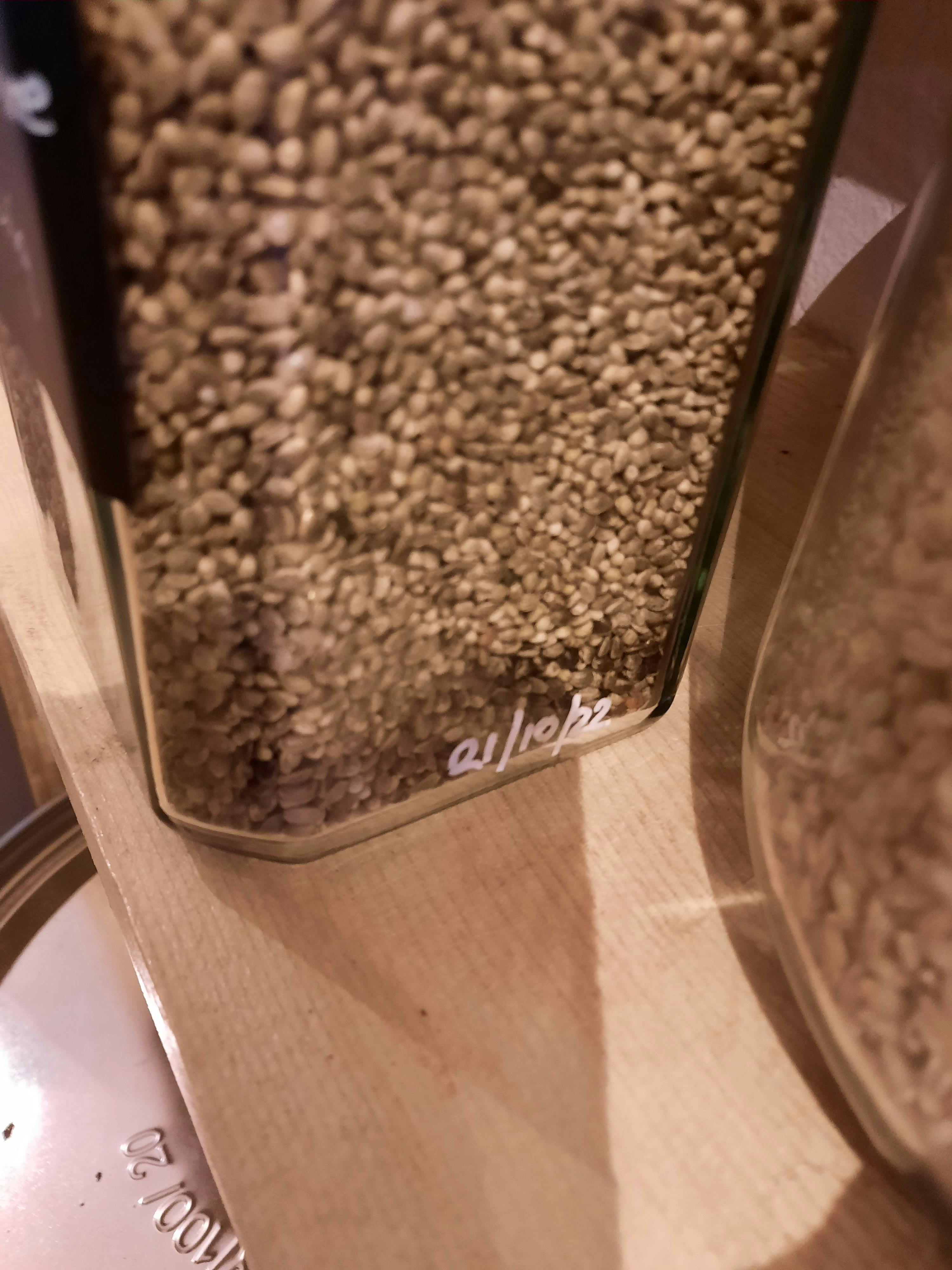 a glass container with the word alleba written on it