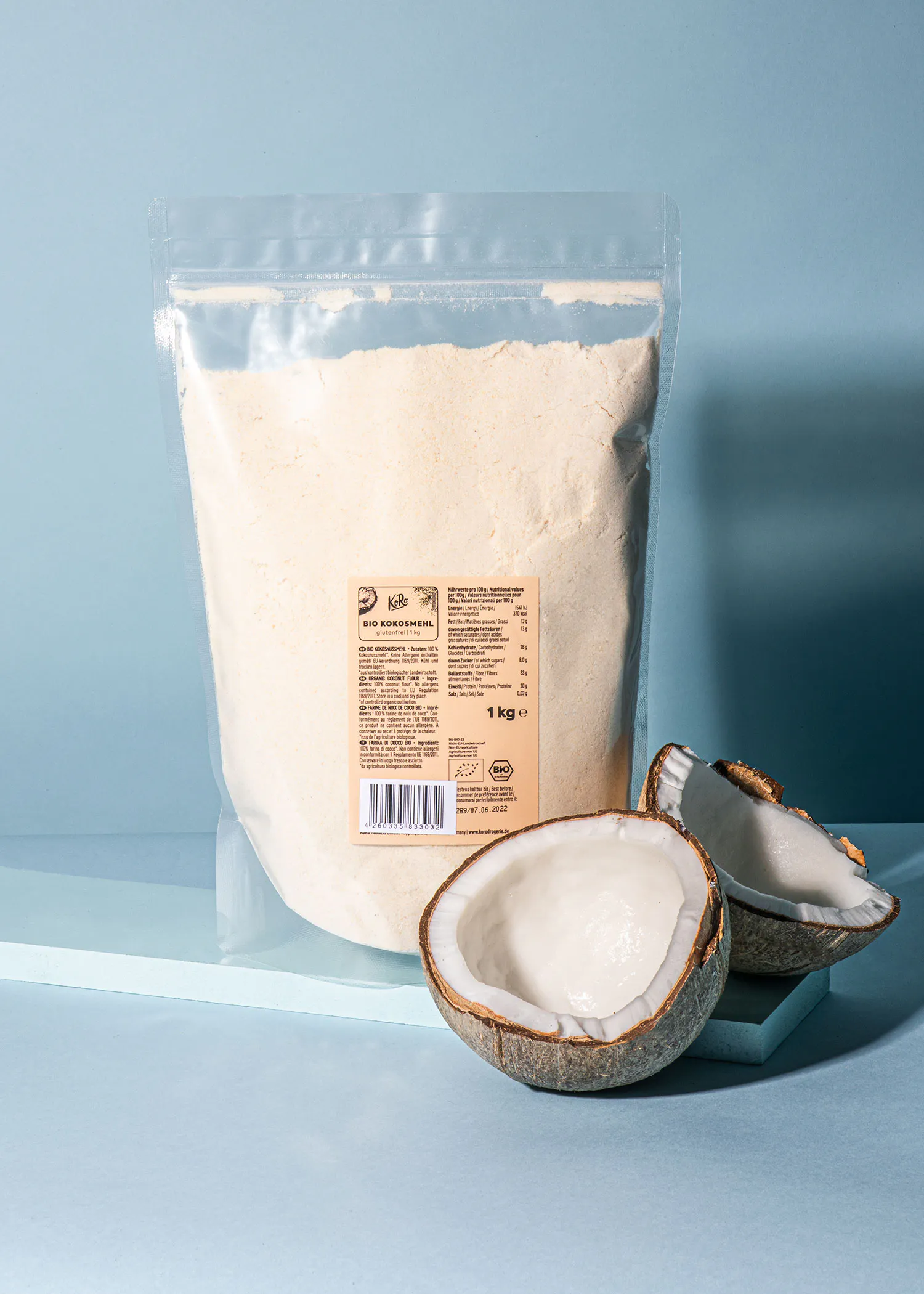 a bag of coconut flour is next to a half of a coconut