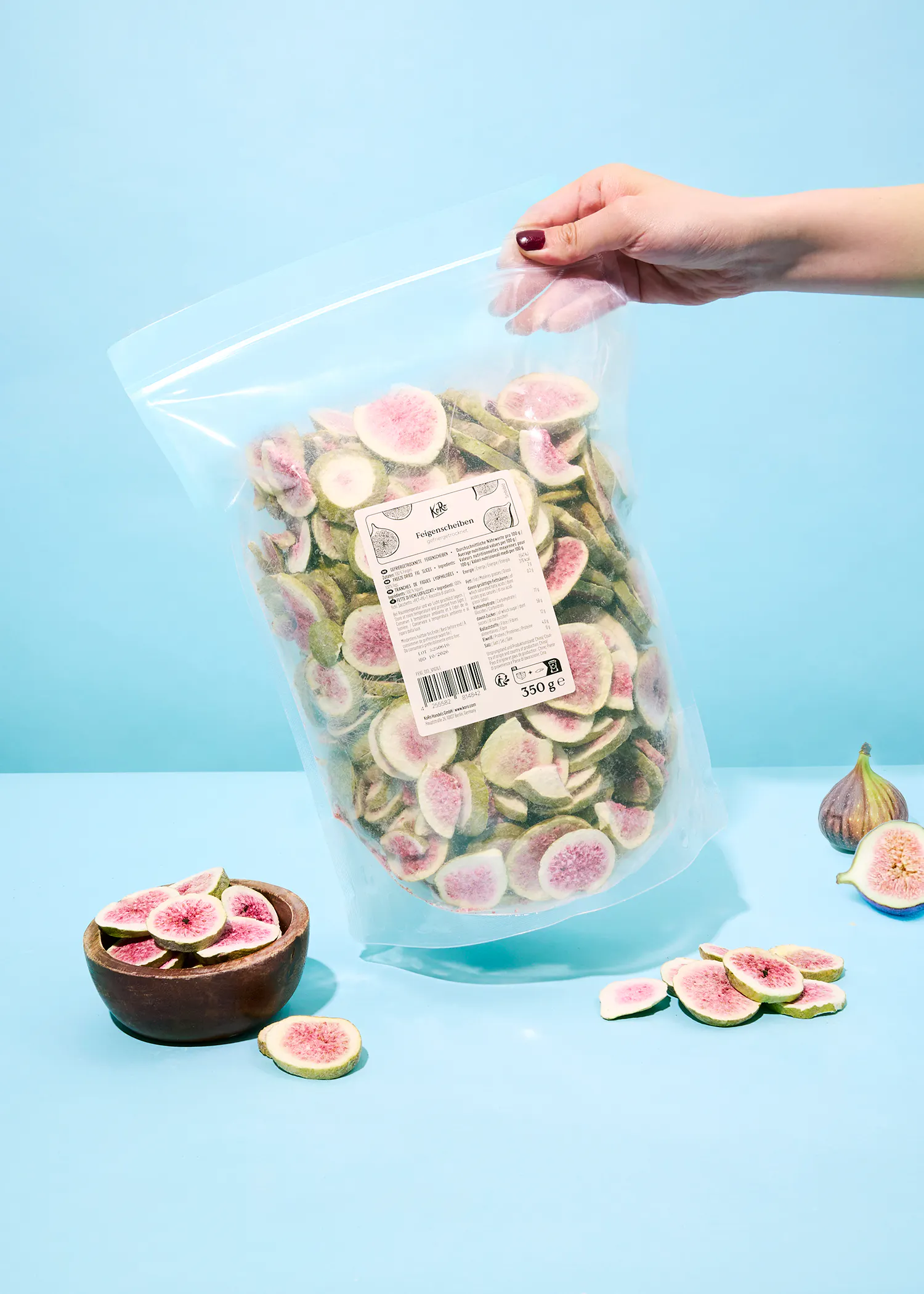 a person is holding a bag of dried figs