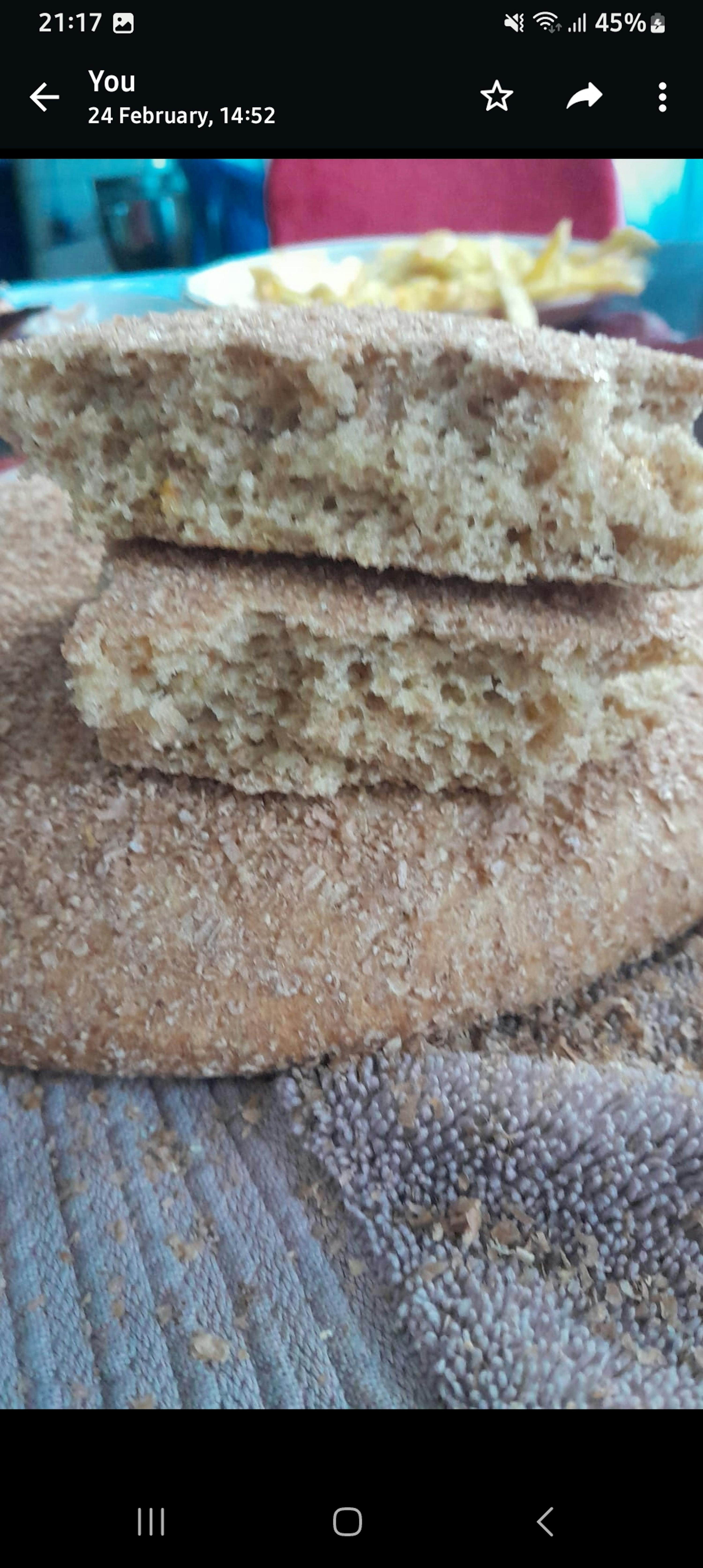 a phone screen shows the time as 21:17