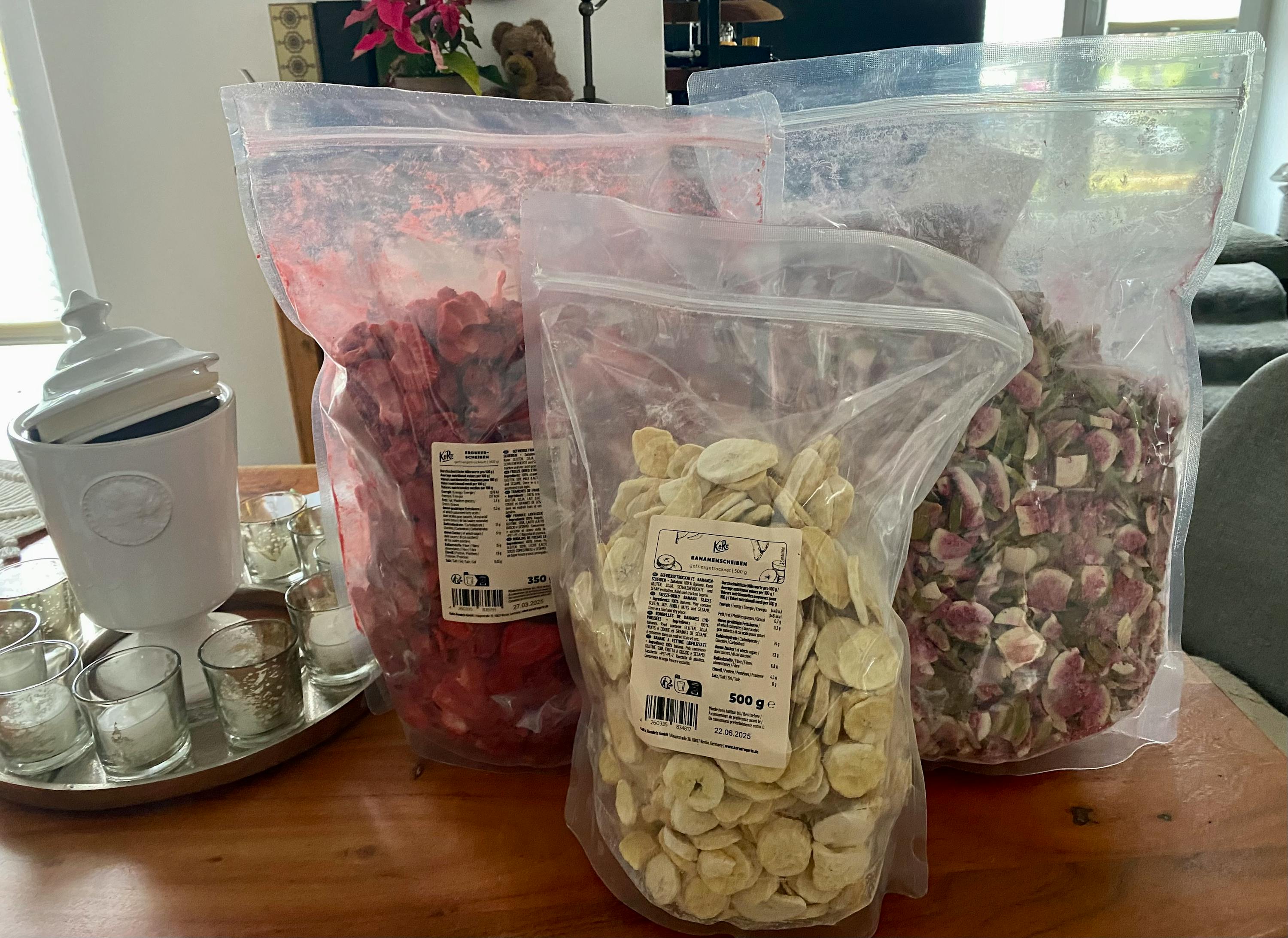 a bag of banana chips sits next to a bag of strawberry chips