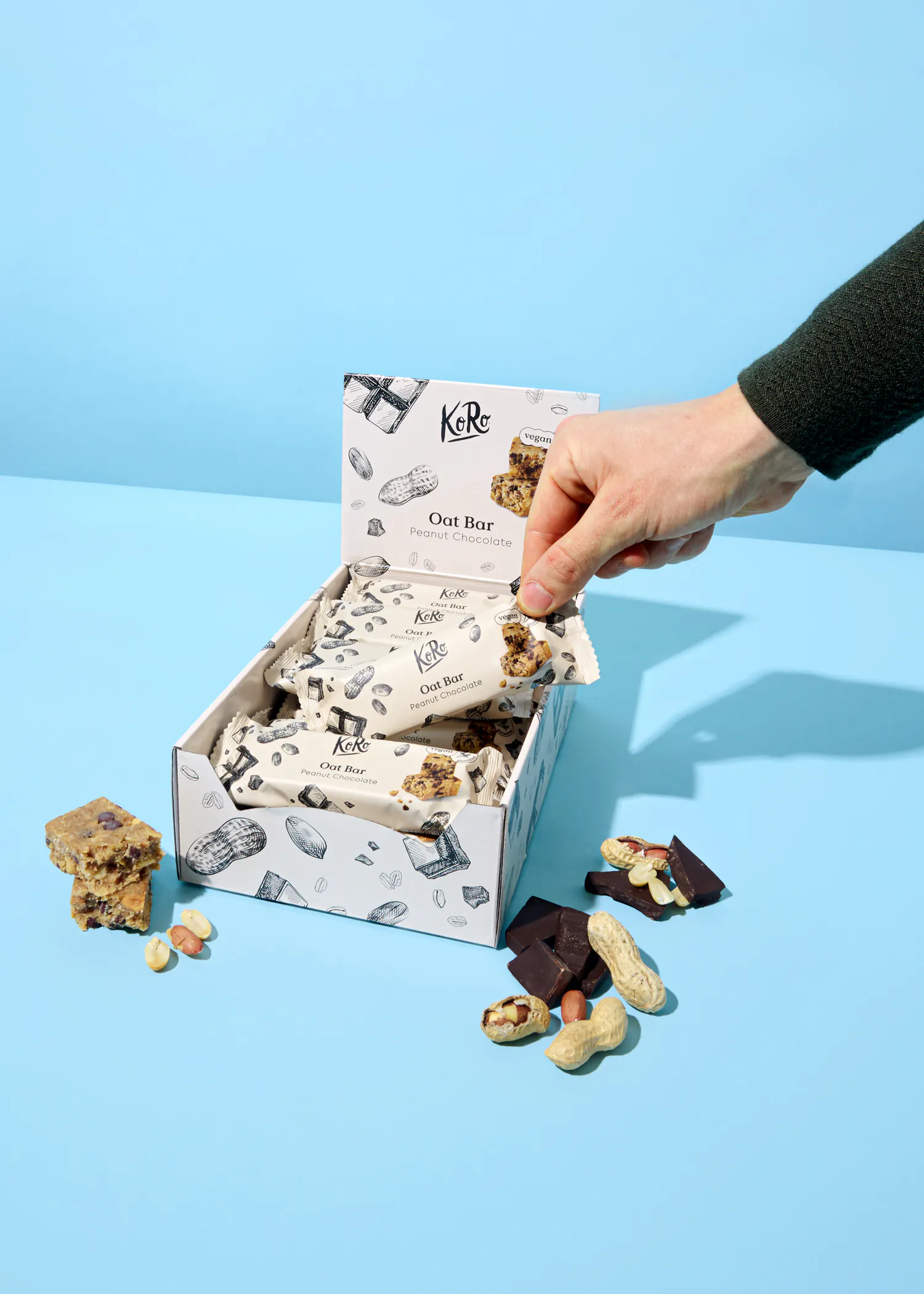 une boîte de barres d' avoine avec des cacahuètes et du chocolat