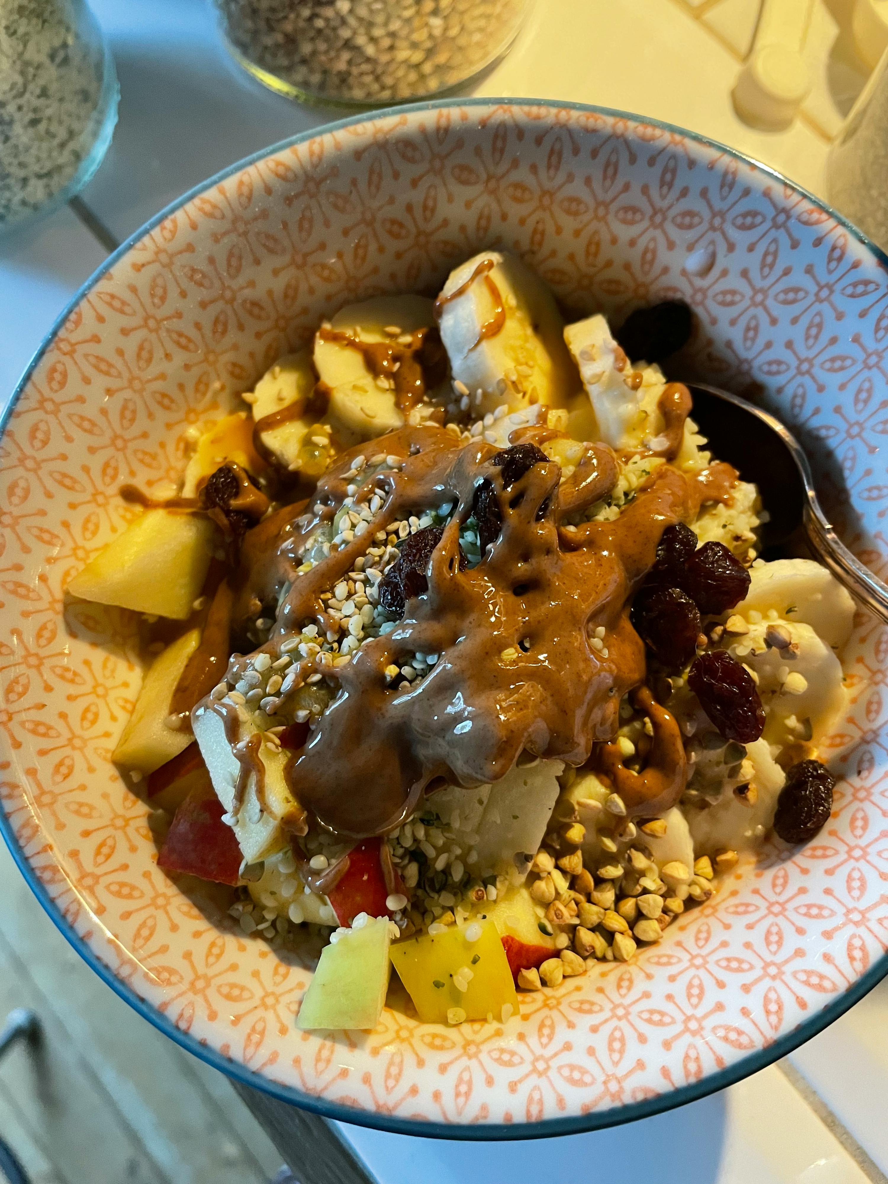 a bowl of food with a spoon in it