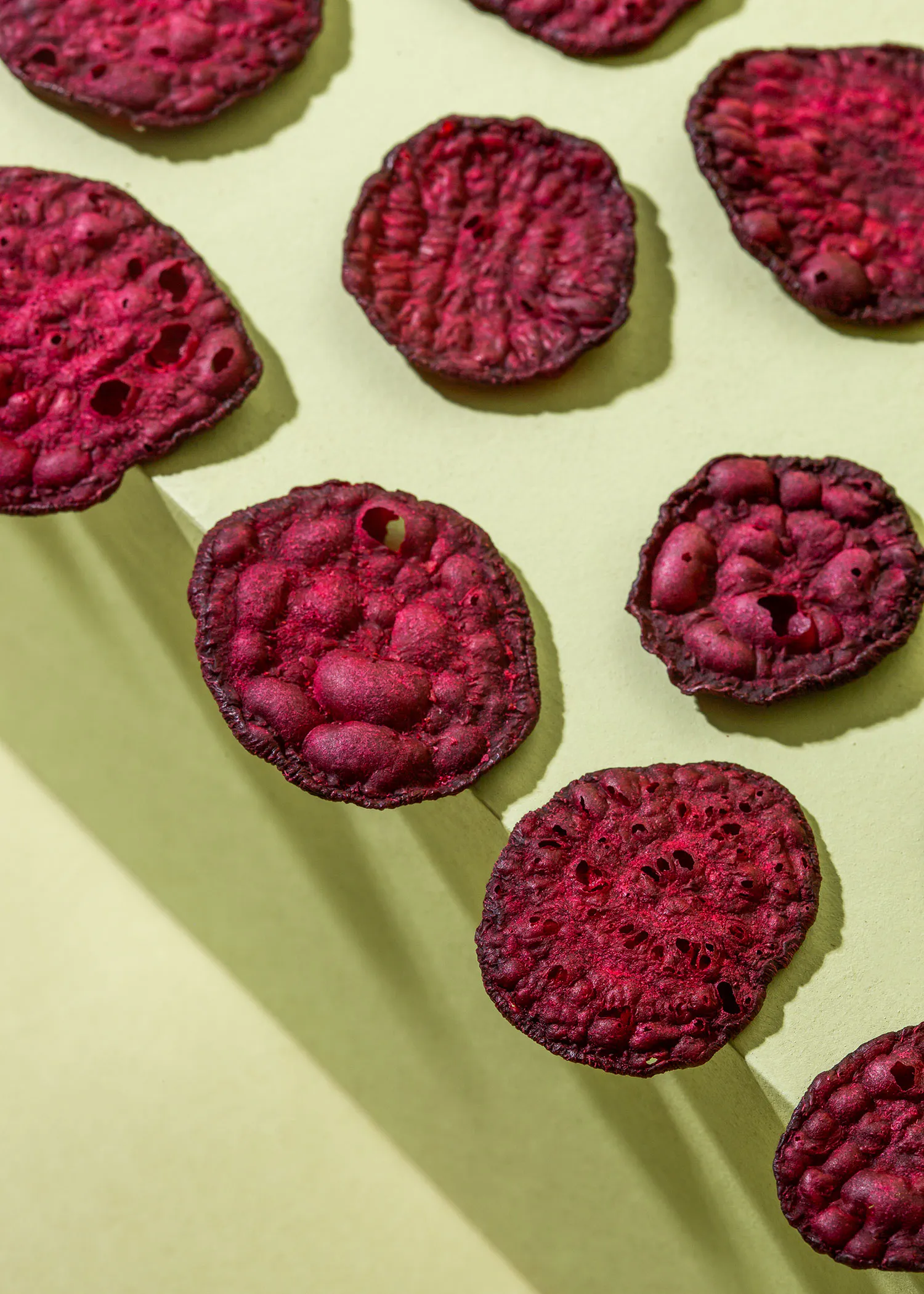 a bunch of purple chips are lined up on a table