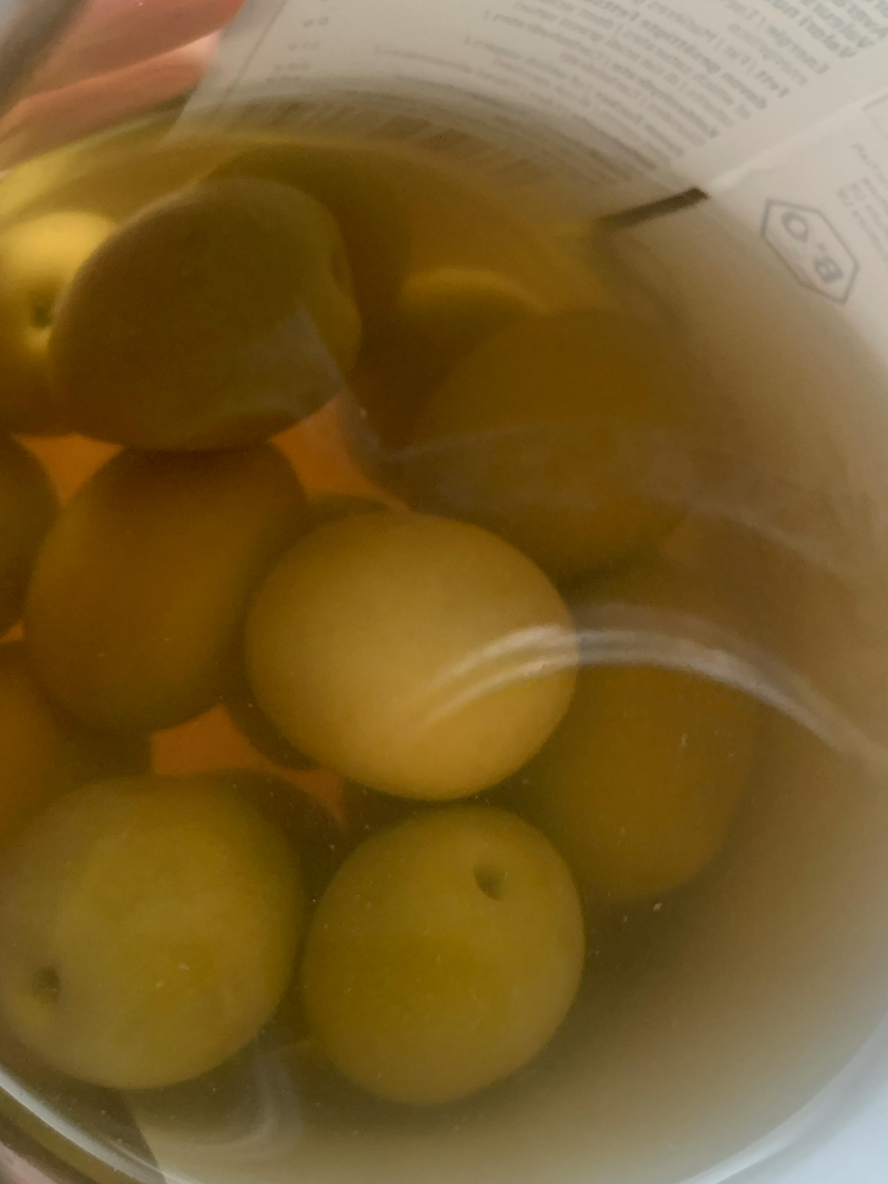 a close up of a container of olives with a label that says bio on it