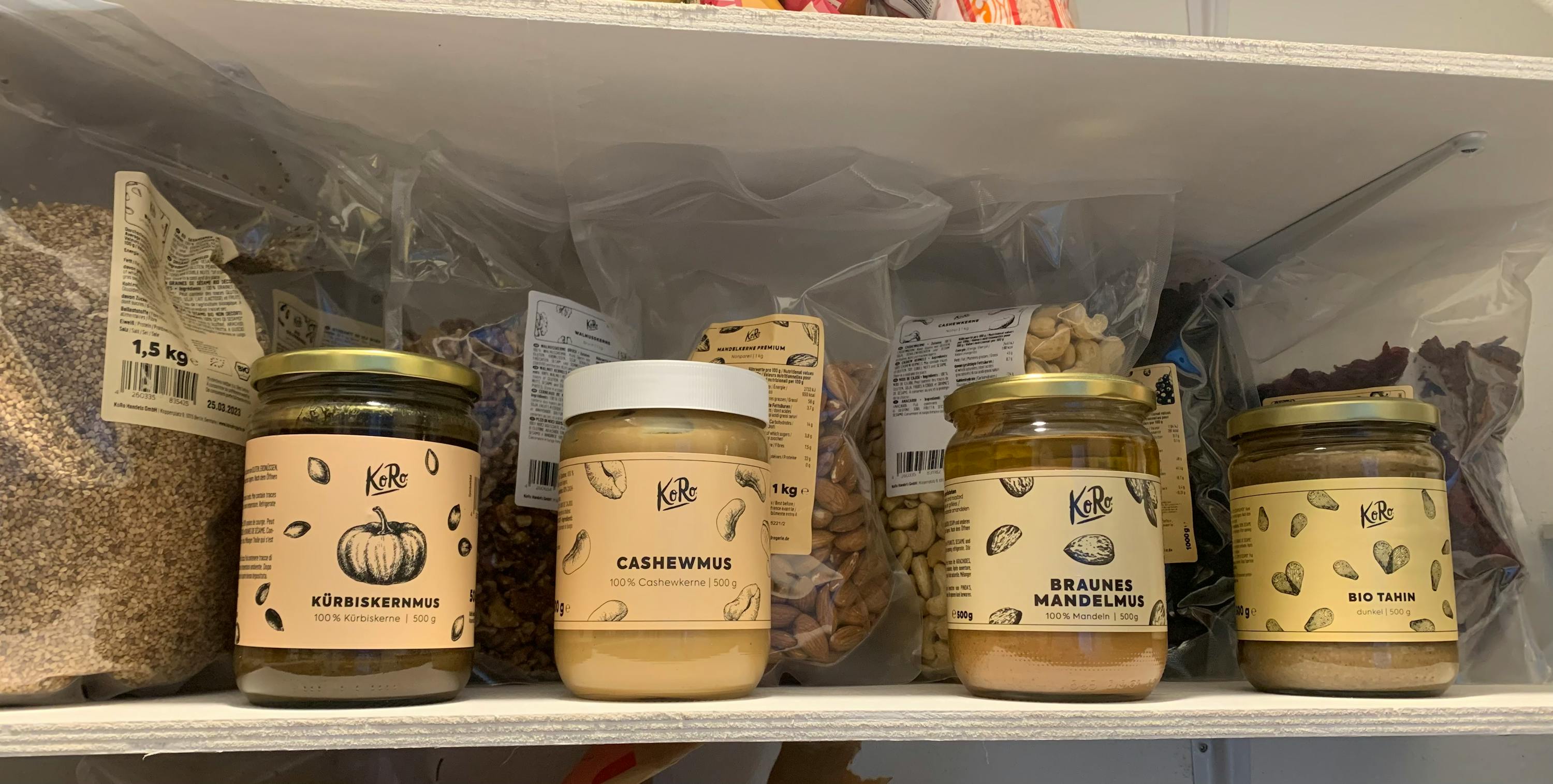 a jar of cashewmus sits on a shelf next to other jars