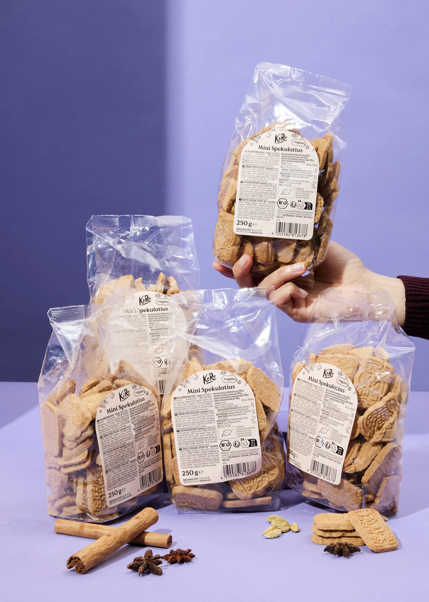 a person holding a bag of mini speculoos cookies