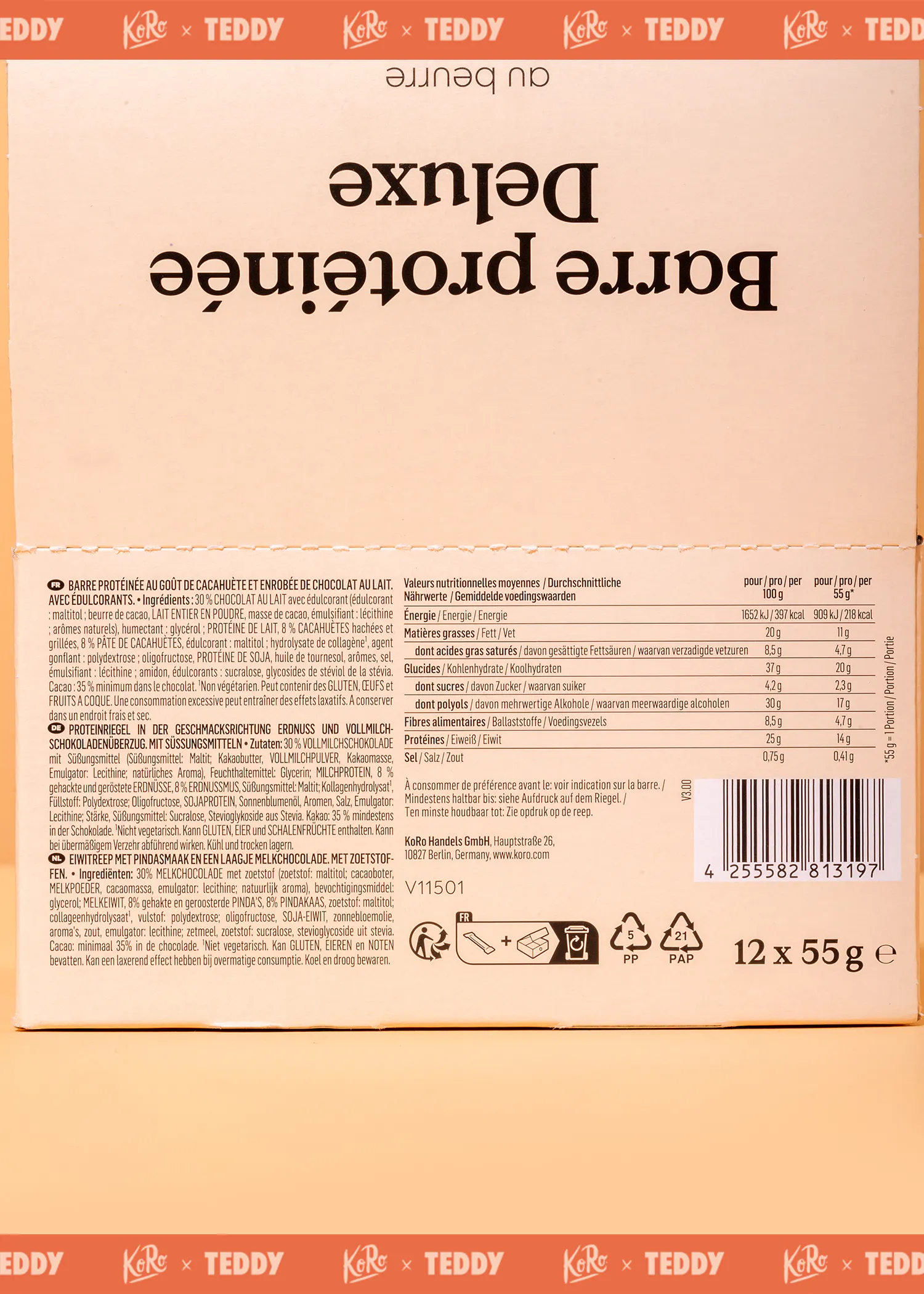 rückseite einer proteinriegel-verpackung mit nährwertangaben und zutatenliste in mehreren sprachen.