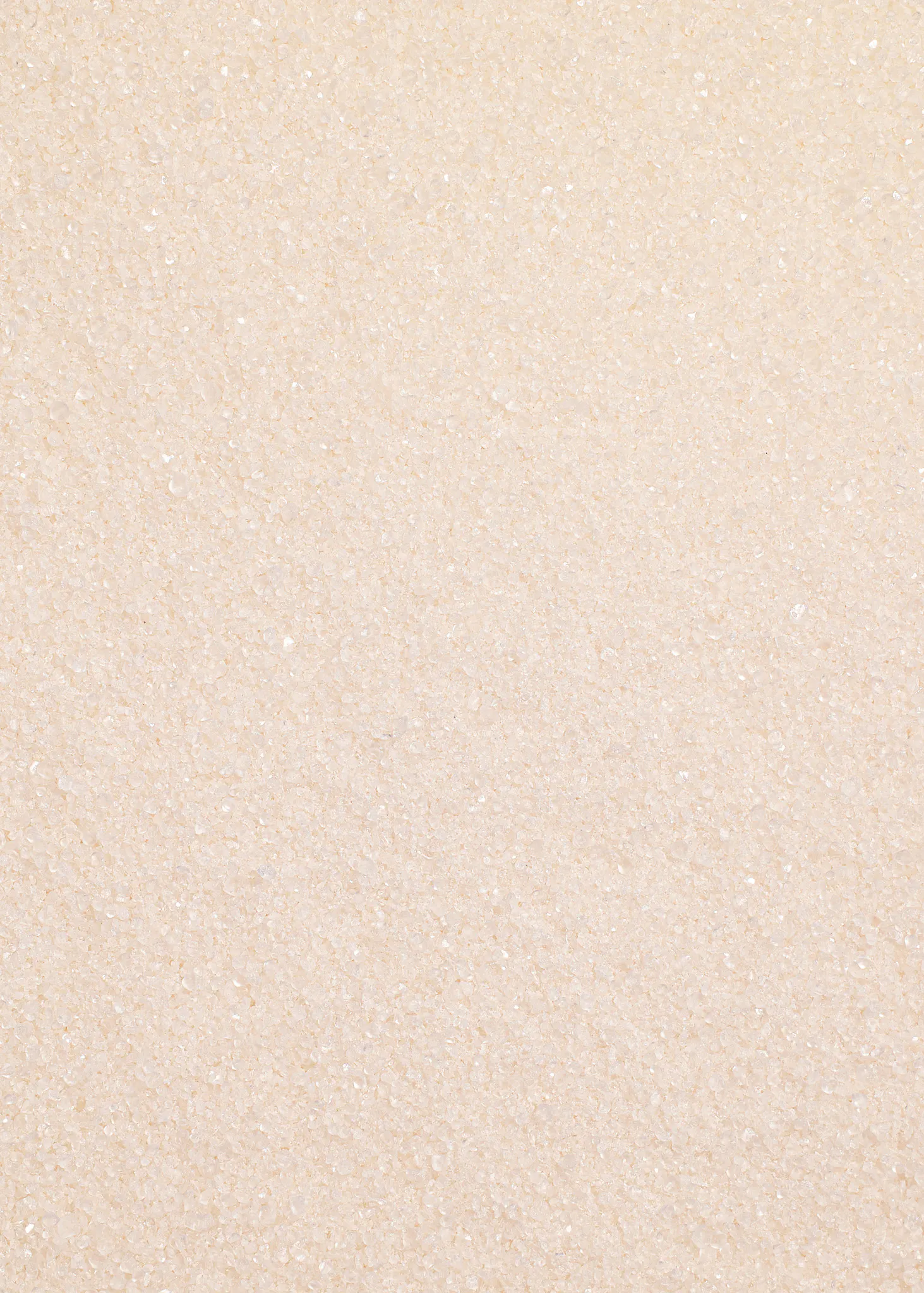 eine Nahaufnahme eines weißen Zuckers mit kleinen Kristallen