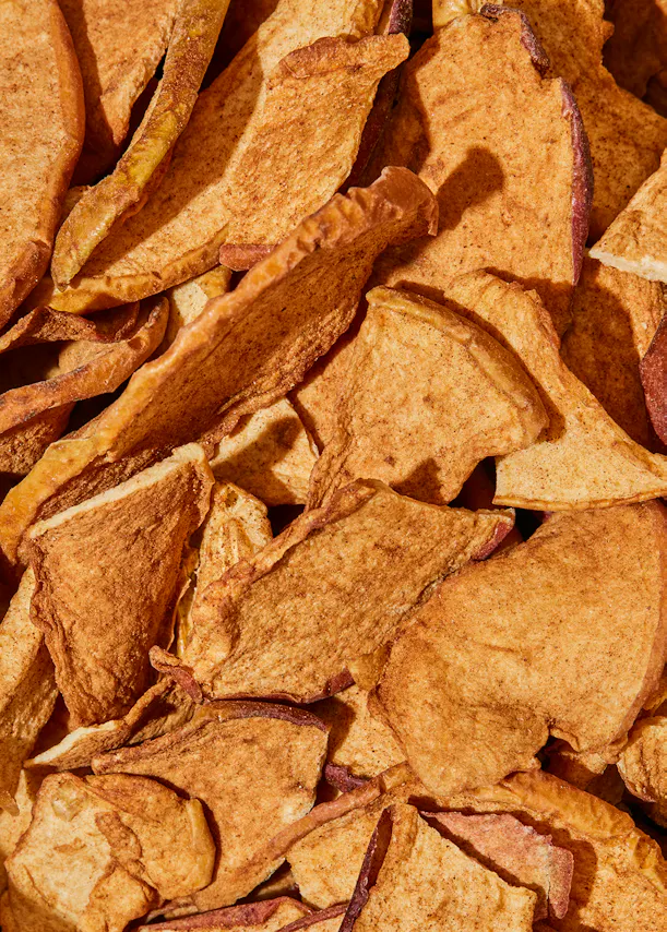a close up of a pile of dried apple chips