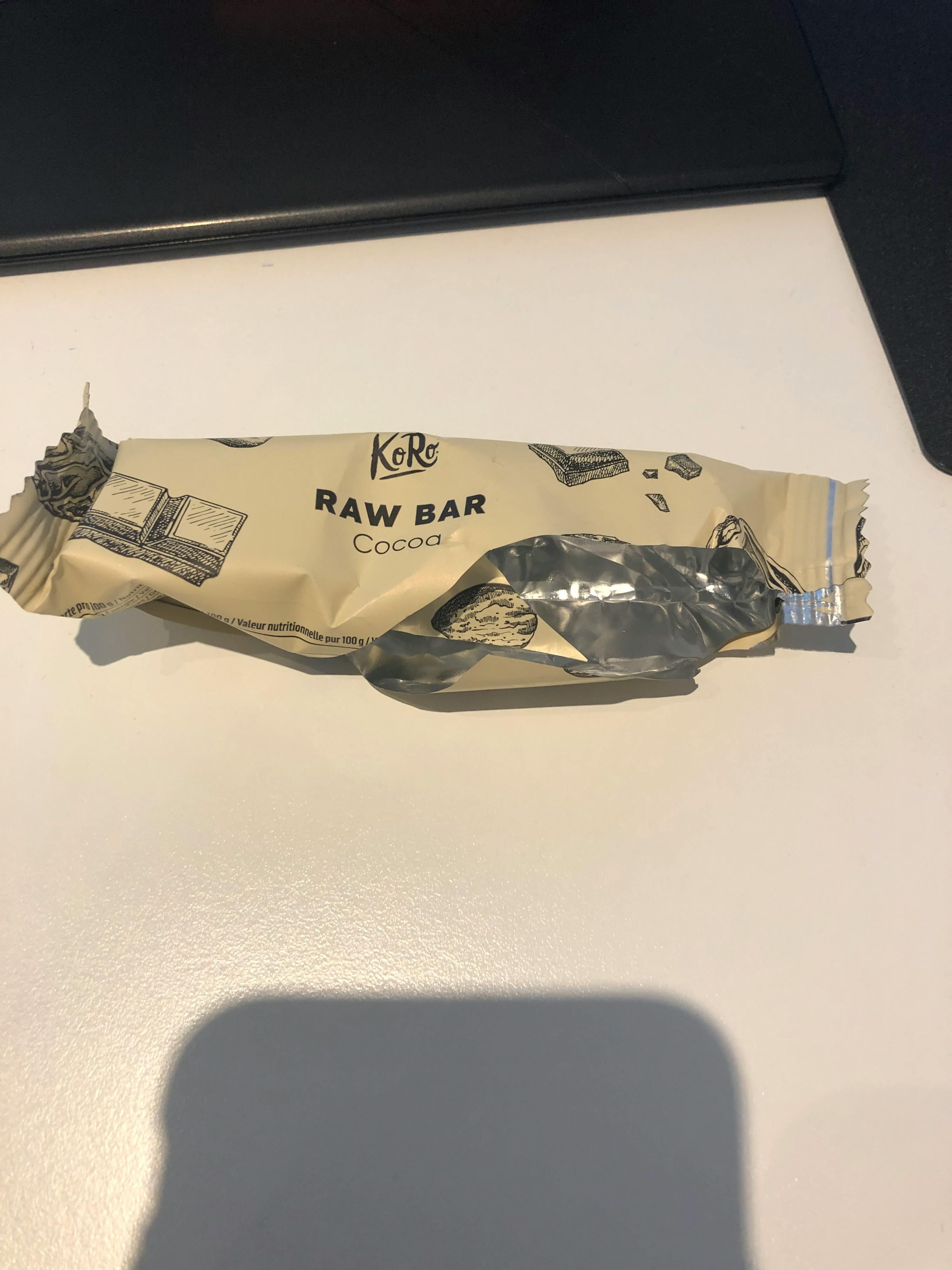 a package of raw bar cocoa sits on a white surface