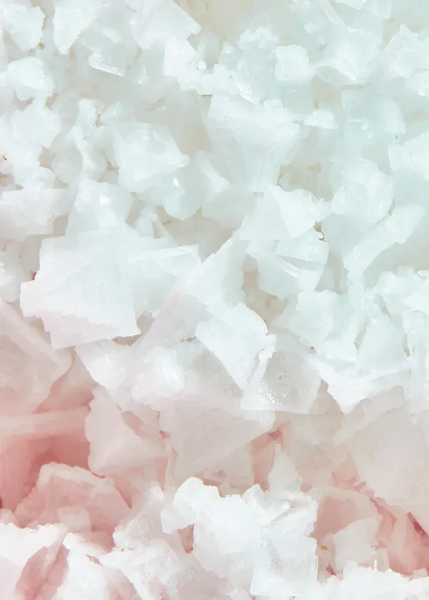 a close up of a pile of white crystals