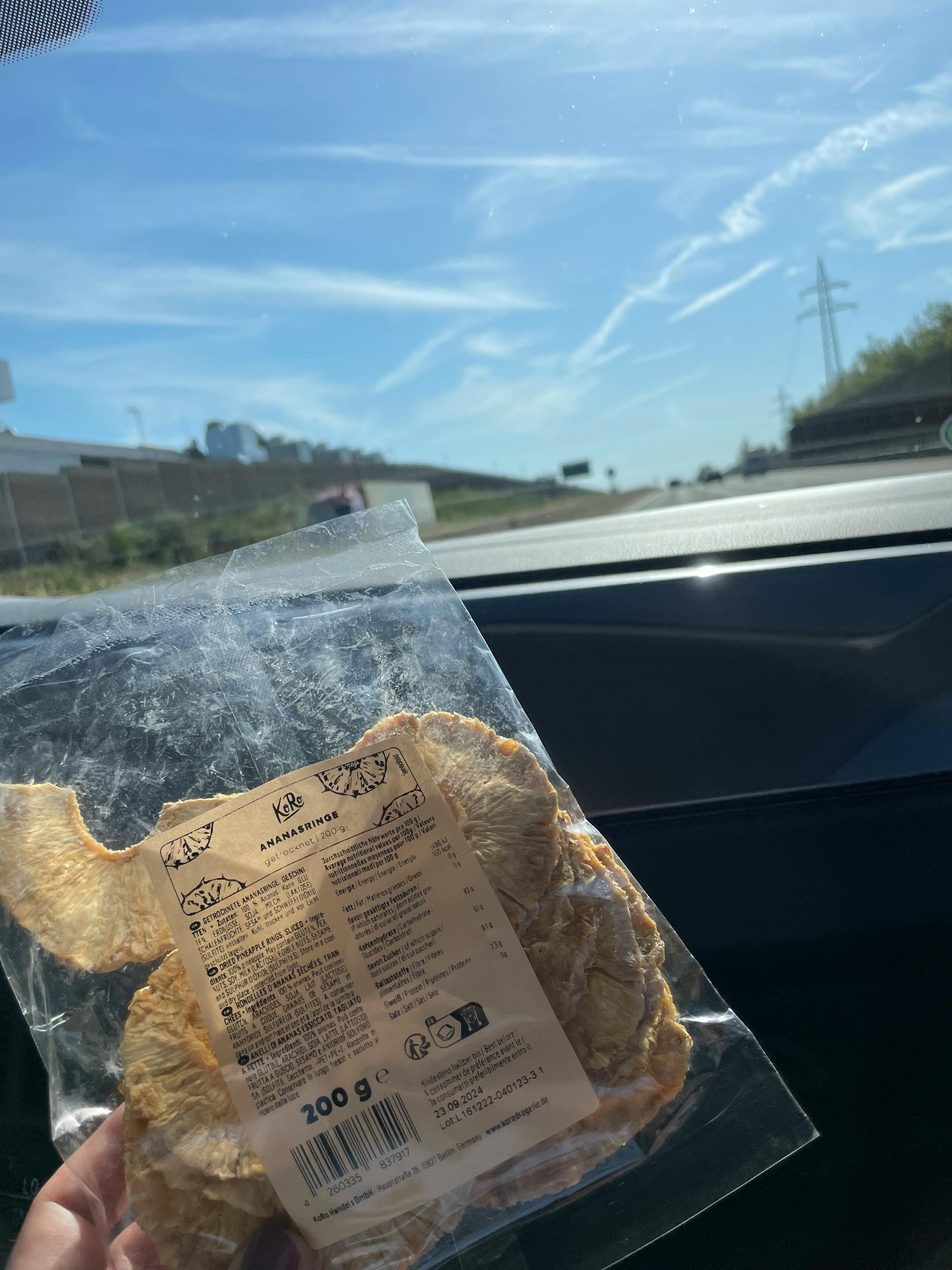 a person is holding a bag of food with a label that says ' sandwiches ' on it