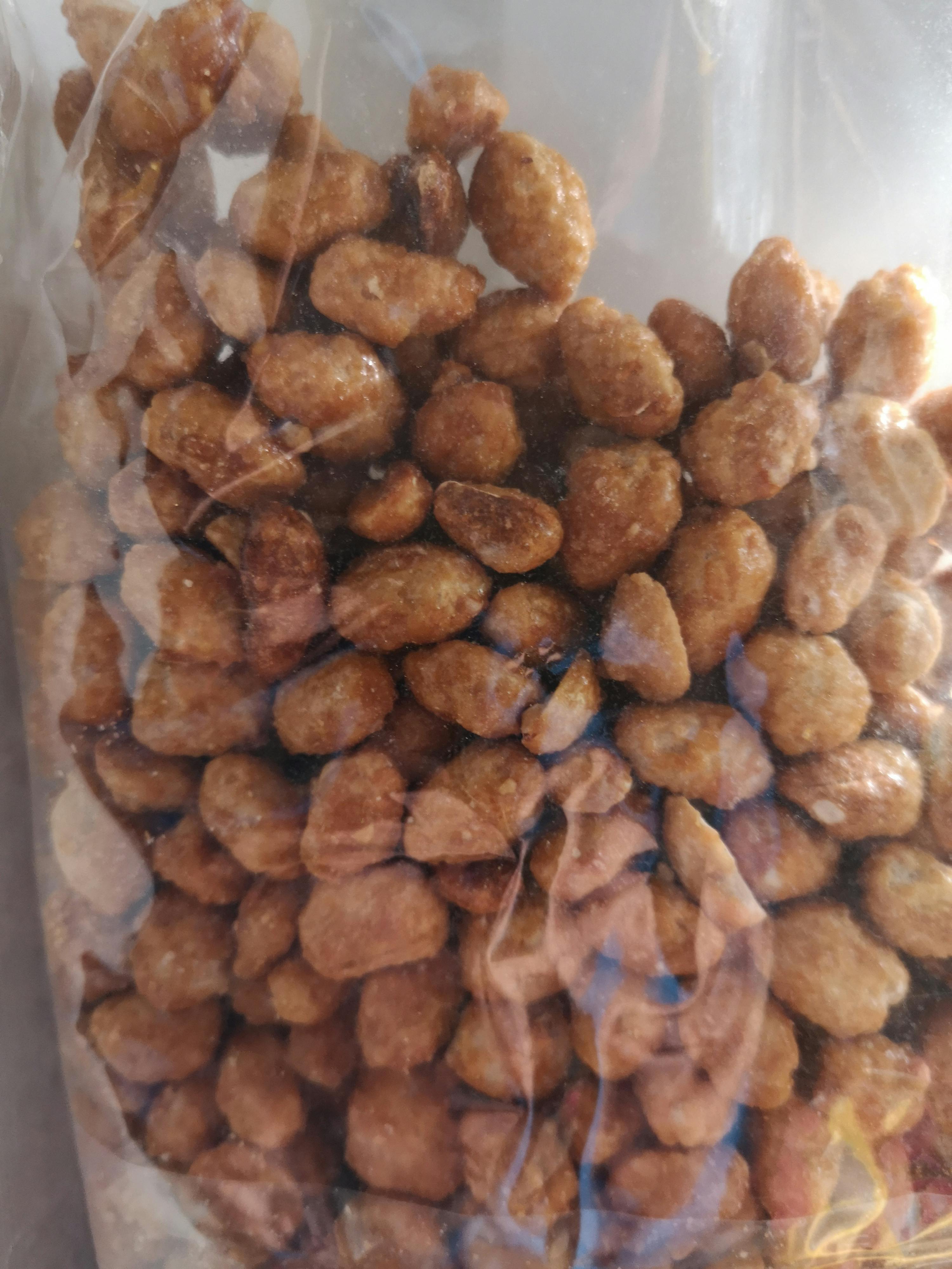 a bag of caramelized peanuts sits on a table