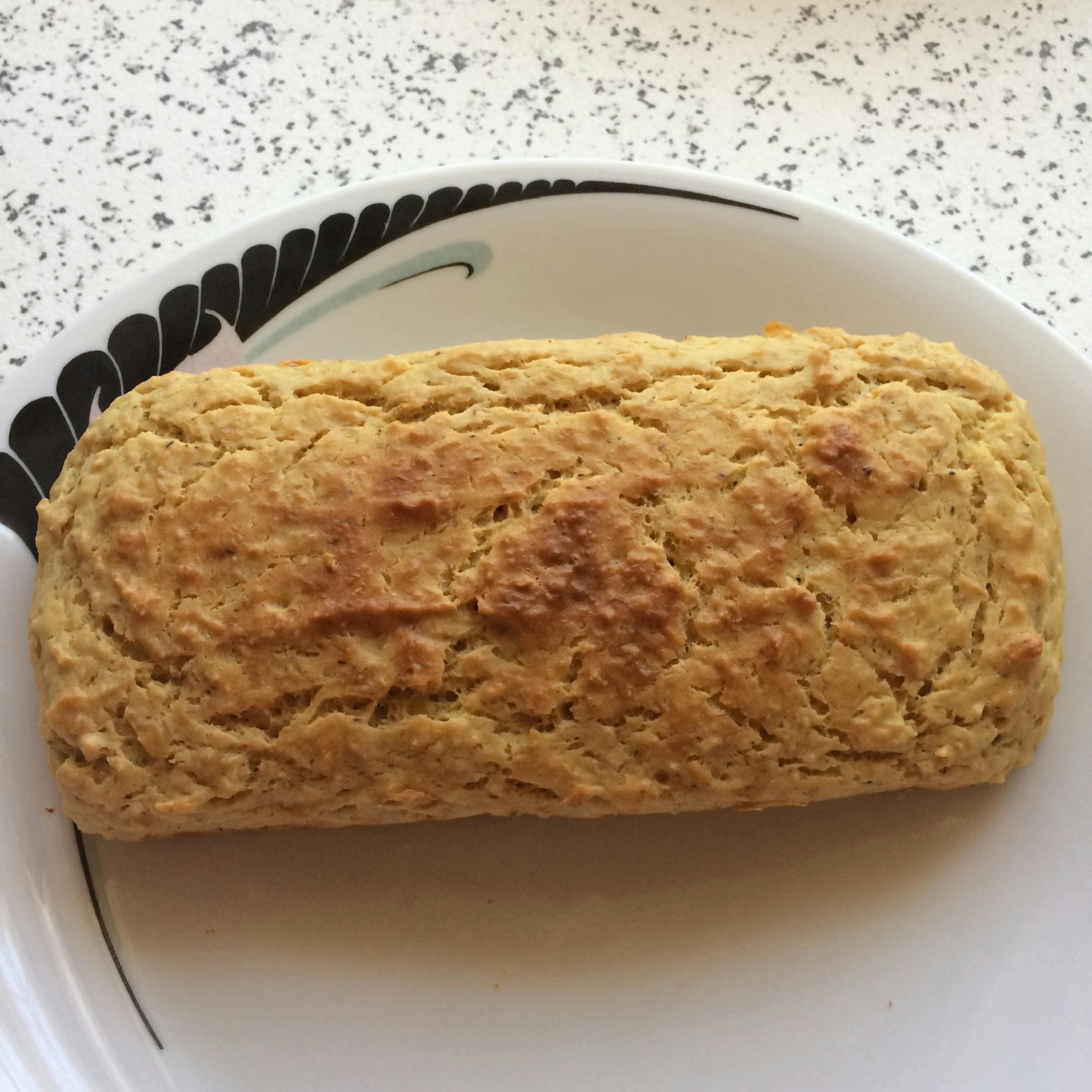 a loaf of bread sits on a white plate