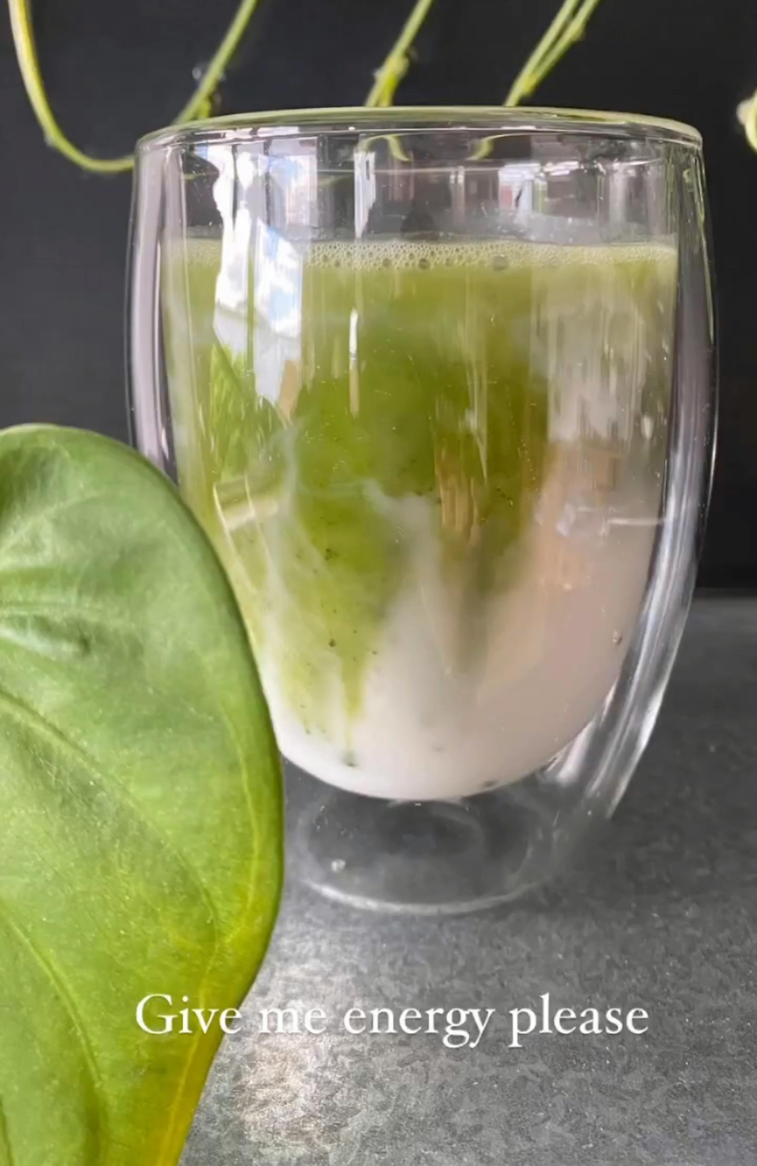 a drink in a glass with the words give me energy please on the bottom