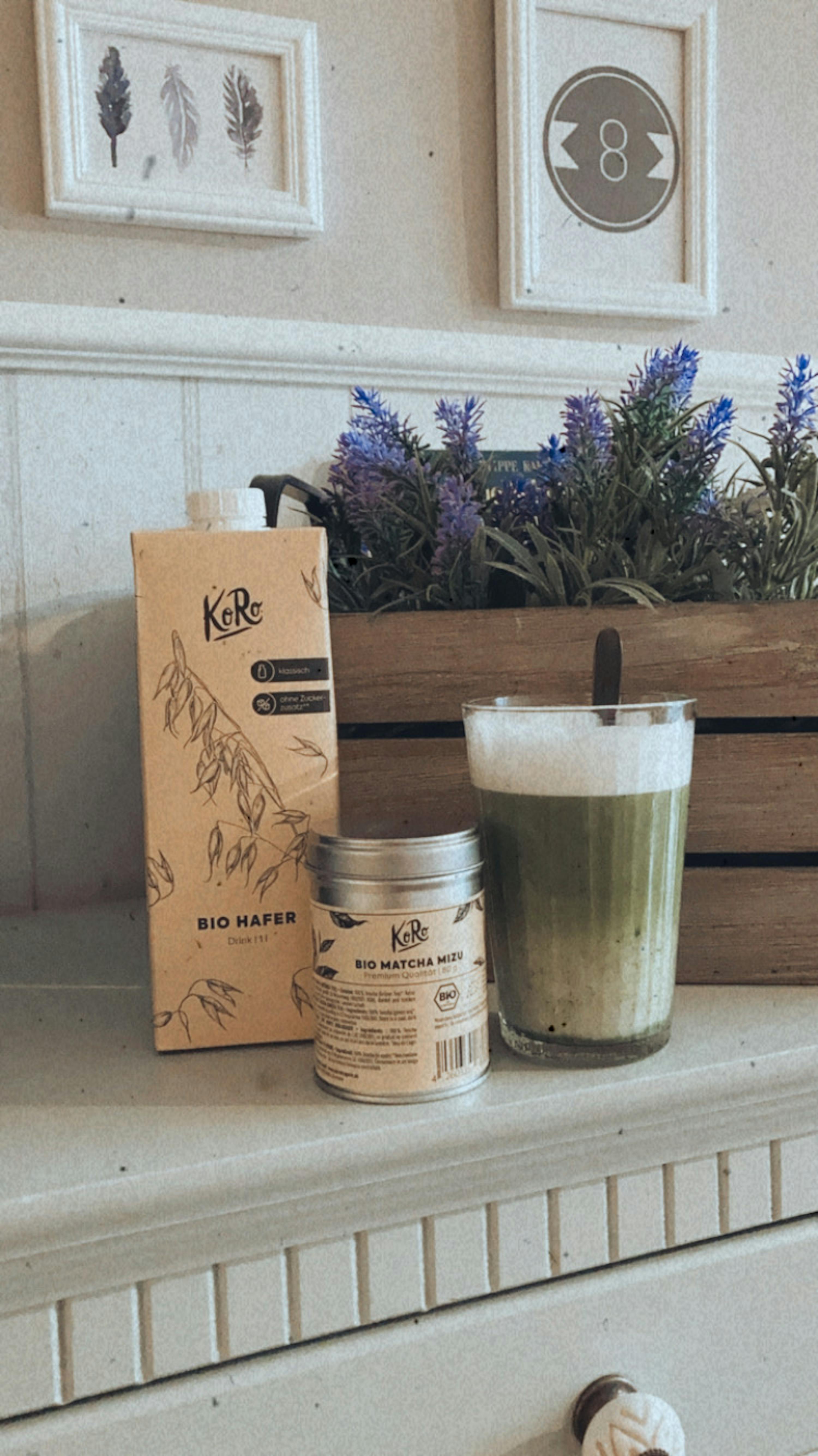 a bottle of bio hafer next to a cup of matcha